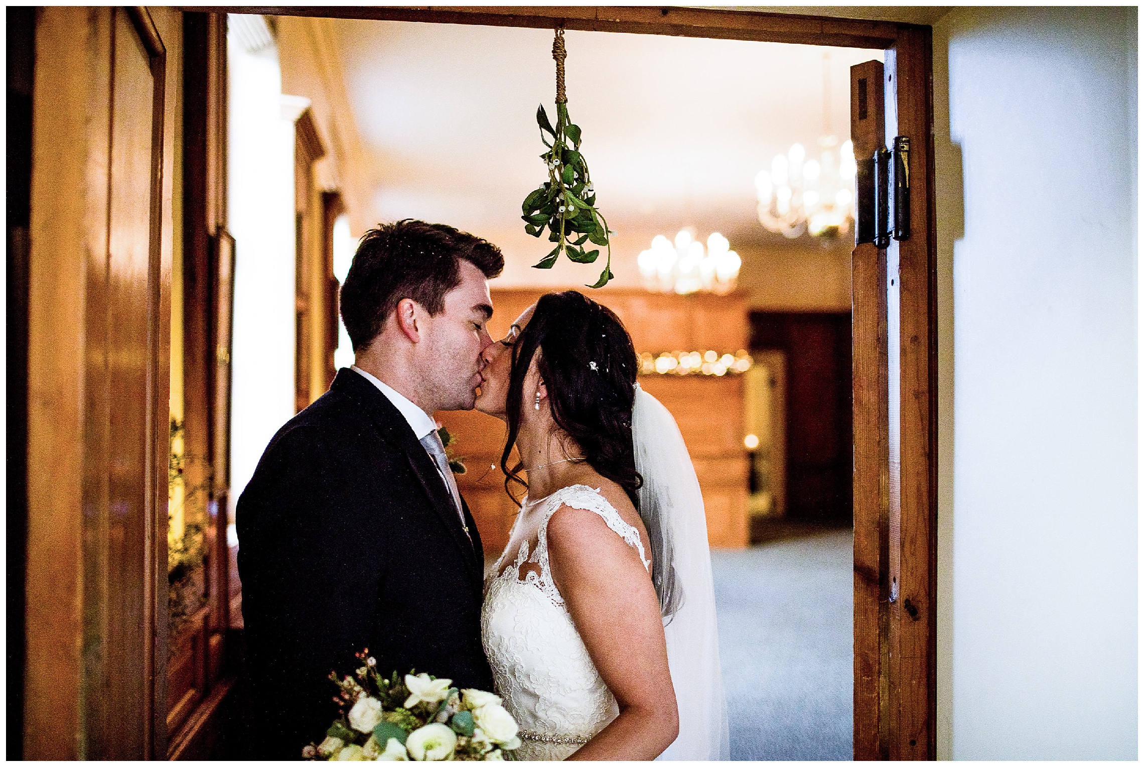 bride and groom under the mistletoe at woburn