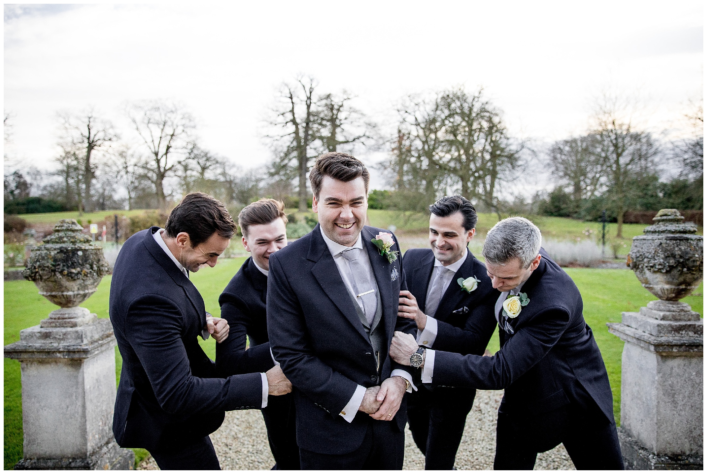 groomsmen having fun at a woburn sculpture gallery wedding