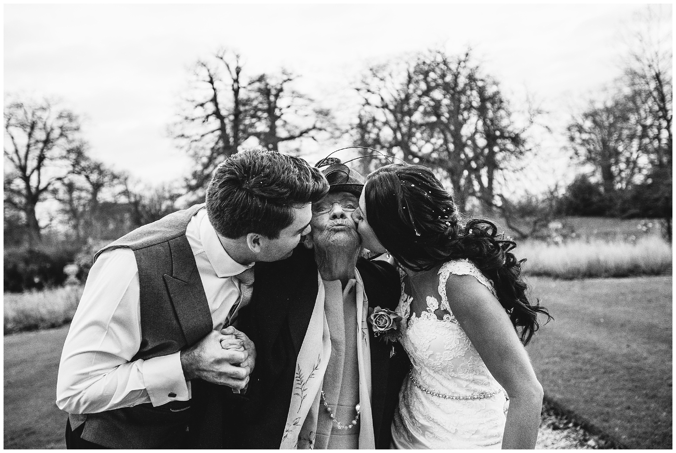 grandma being kissed by bride and groom at a woburn sculpture gallery wedding