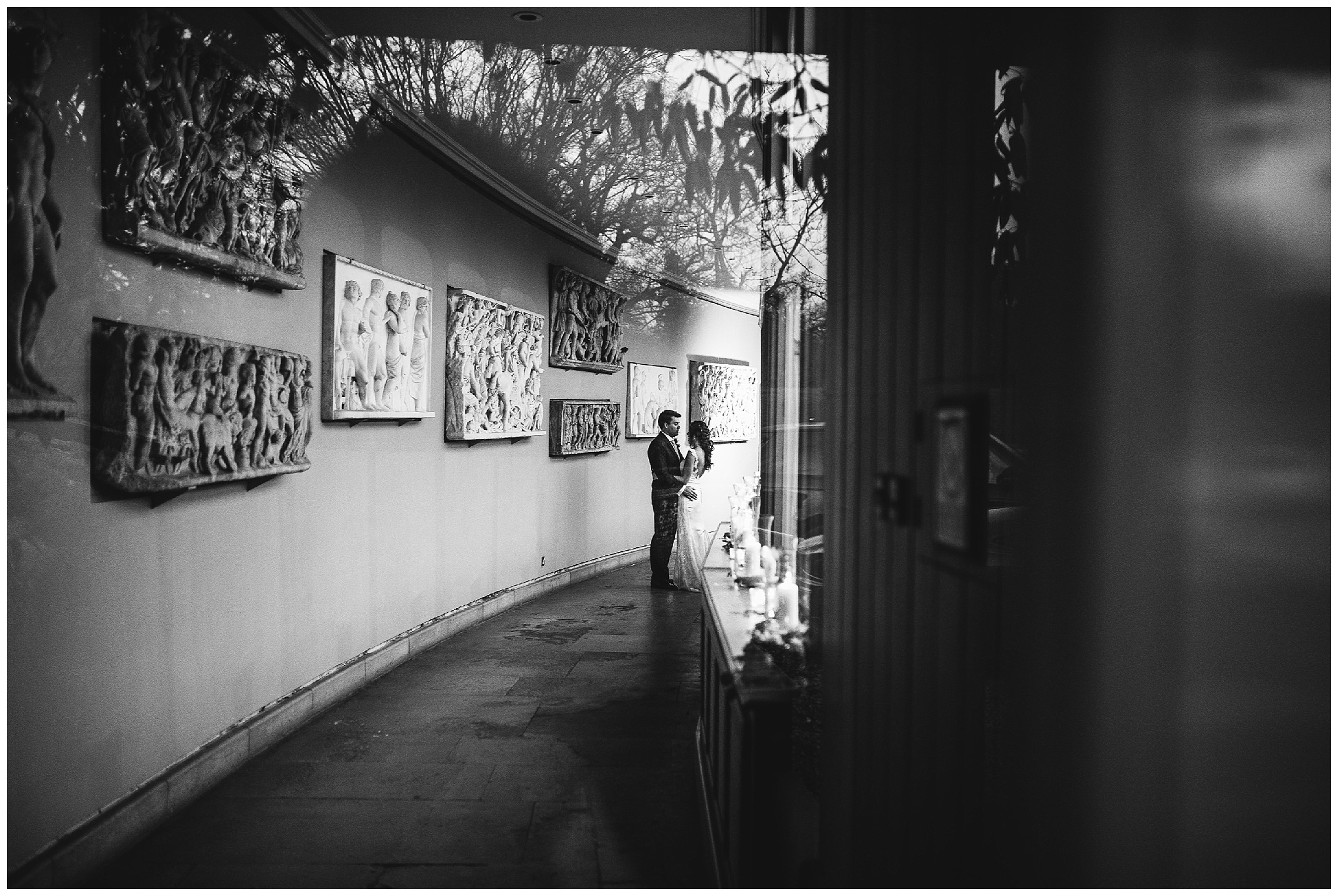 bride and groom in henry holland corridor at a woburn sculpture gallery wedding