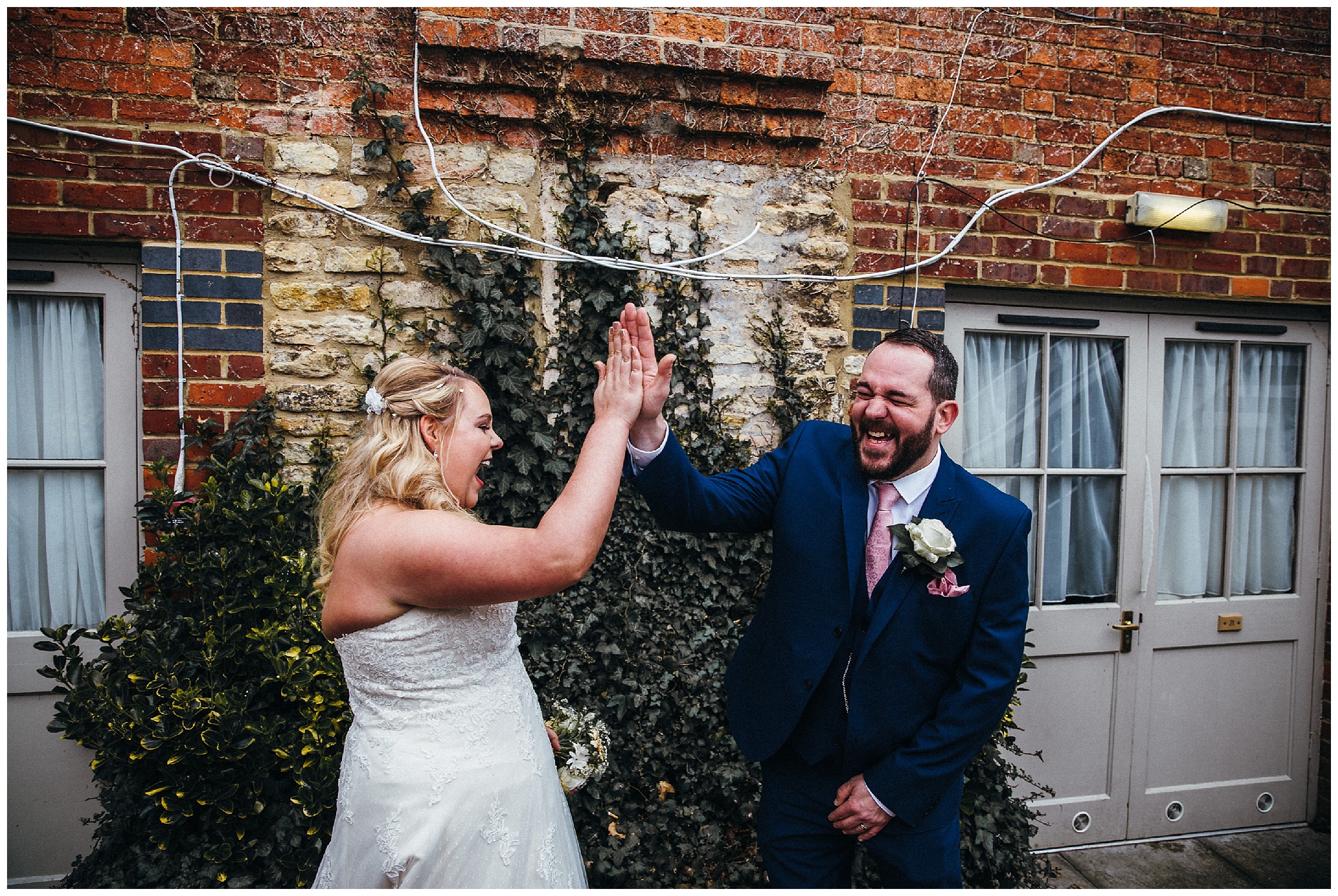 high five with the bride and groom at the cock hotel