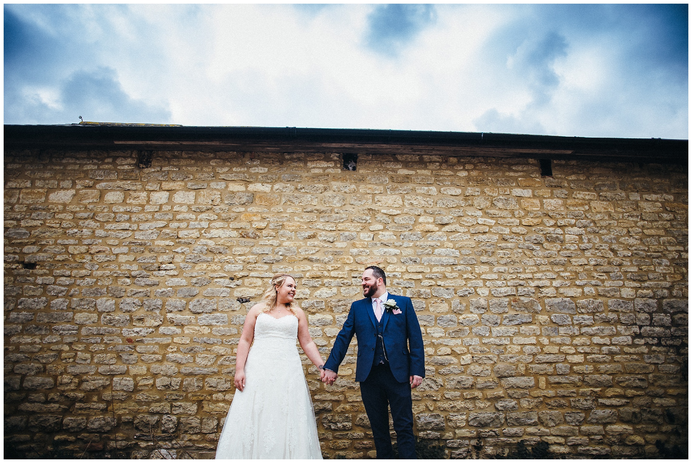 bride and groom holding hands