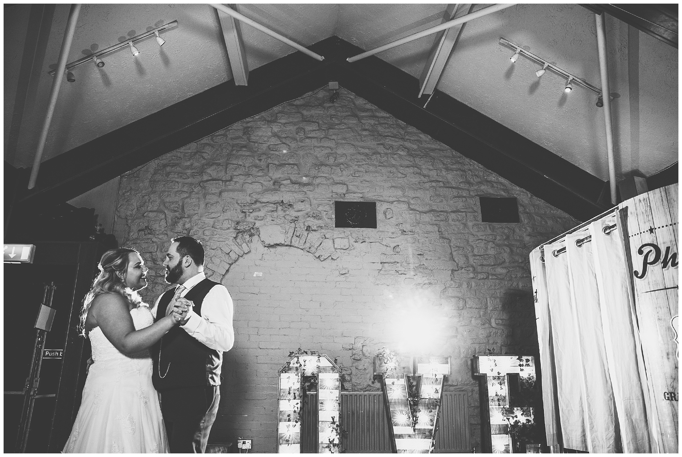 first dance in front of love lights at the cock hotel wedding