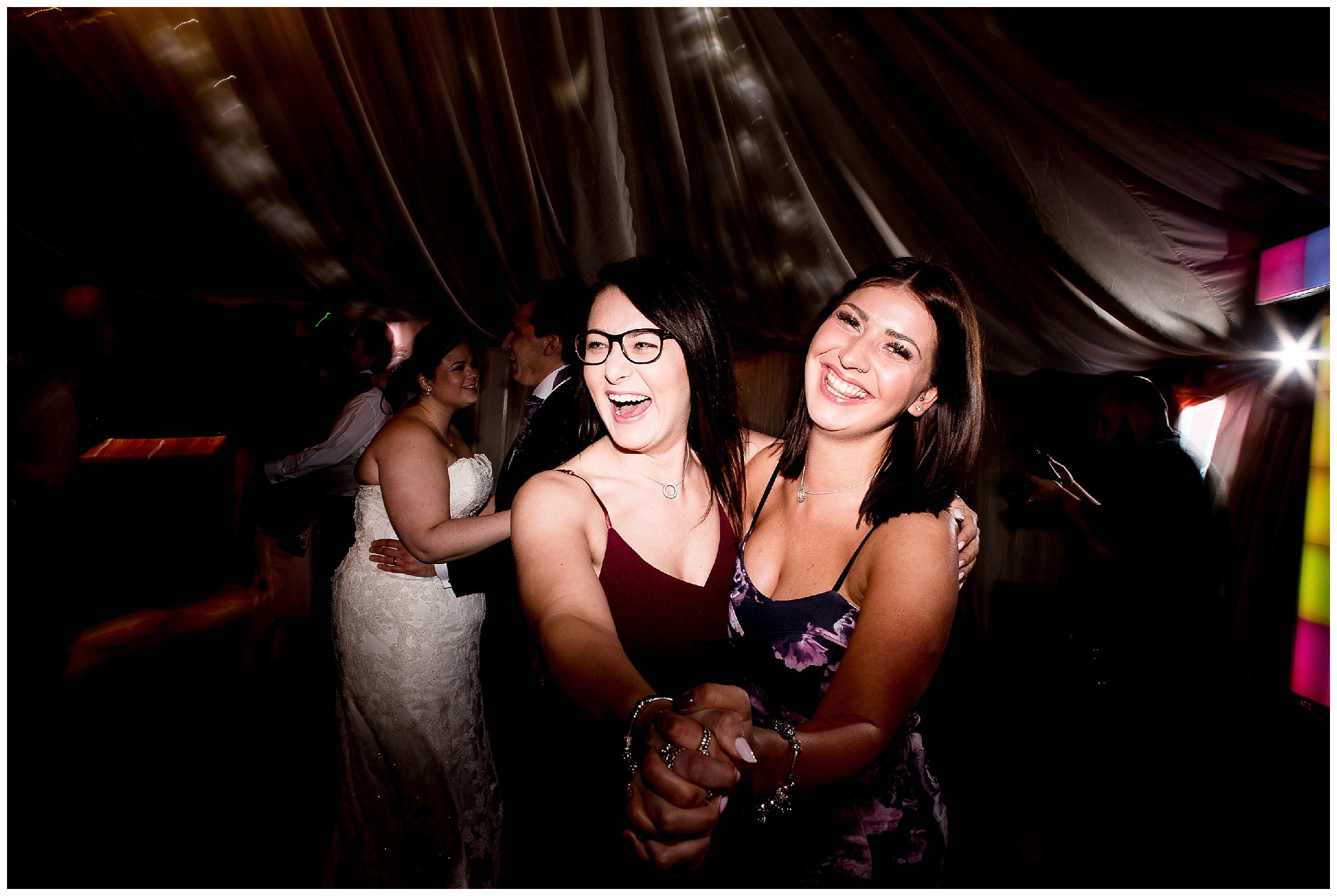 wedding guests dance hand in hand