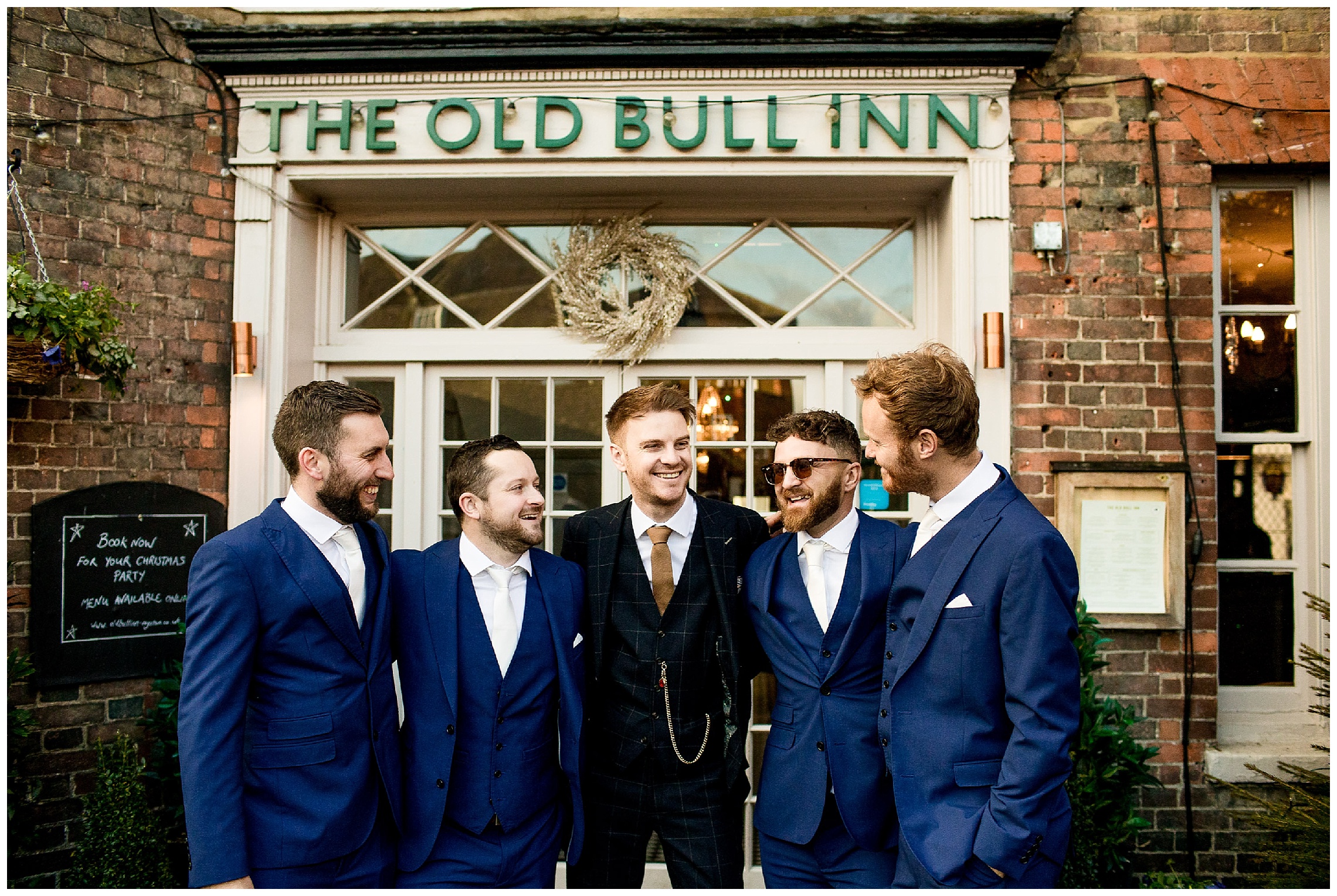 the old bull in groomsmen outside laughing