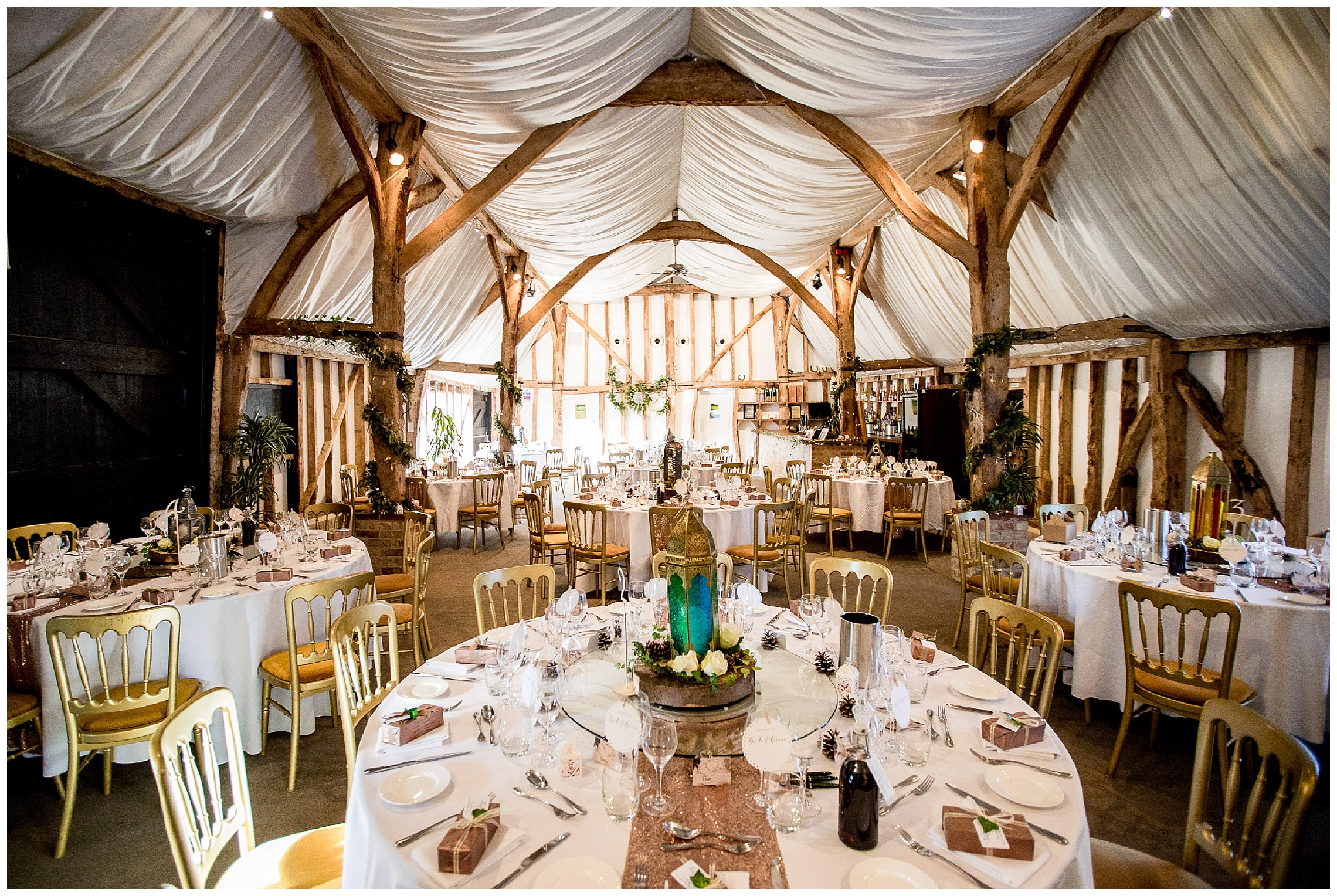 the barn at south farm dressed for a wedding with gold