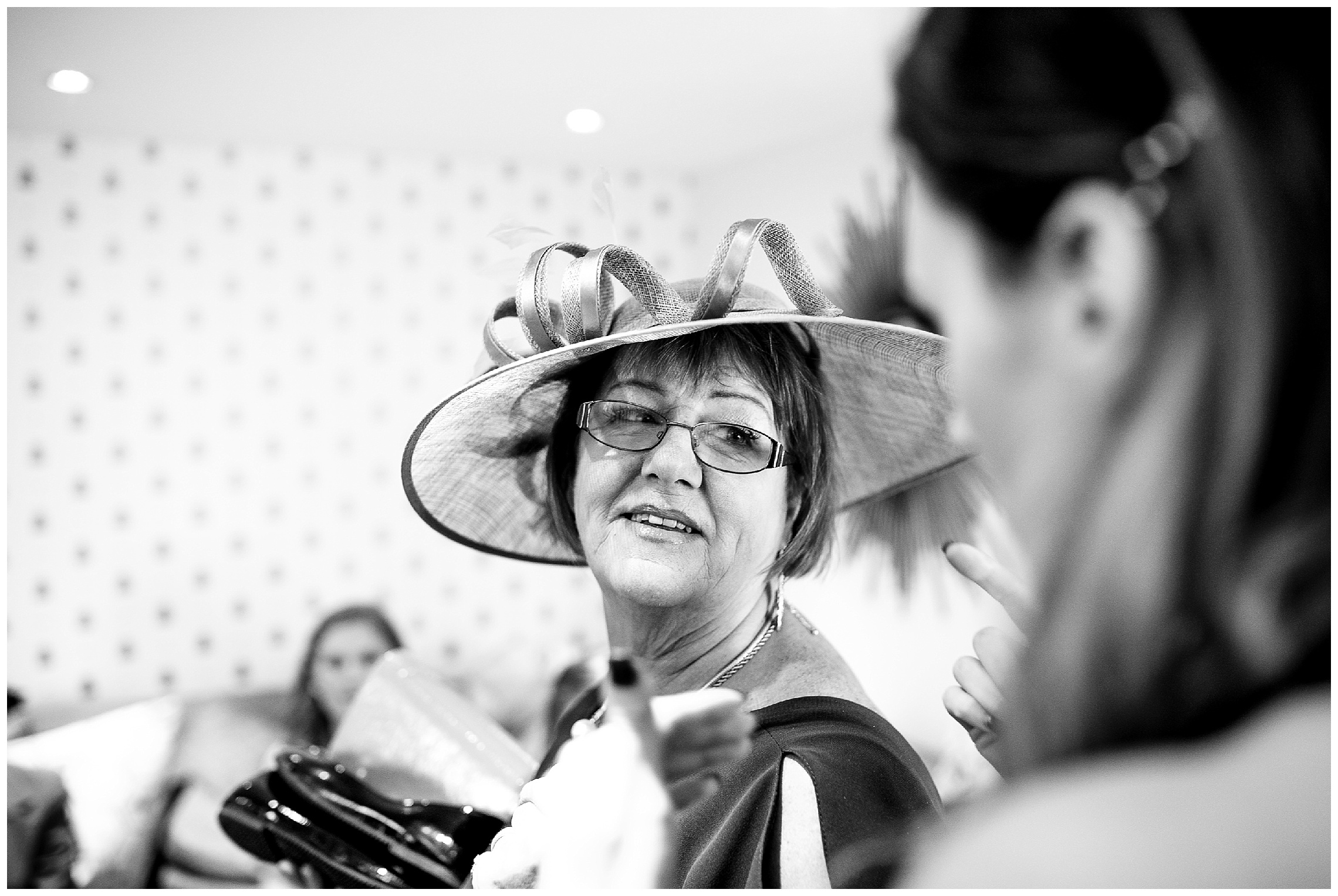 mother of the bride with a hat on ready to go