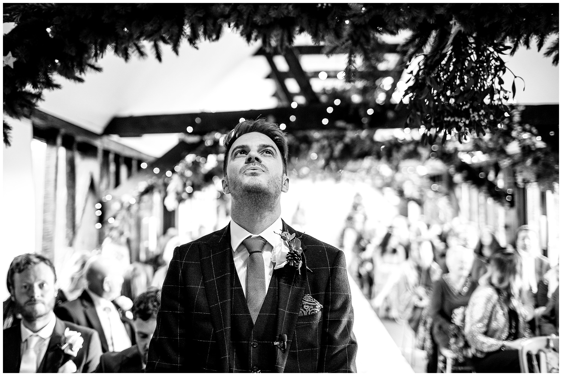 groom exhales as he waits for his bride in the old dairy at south farm