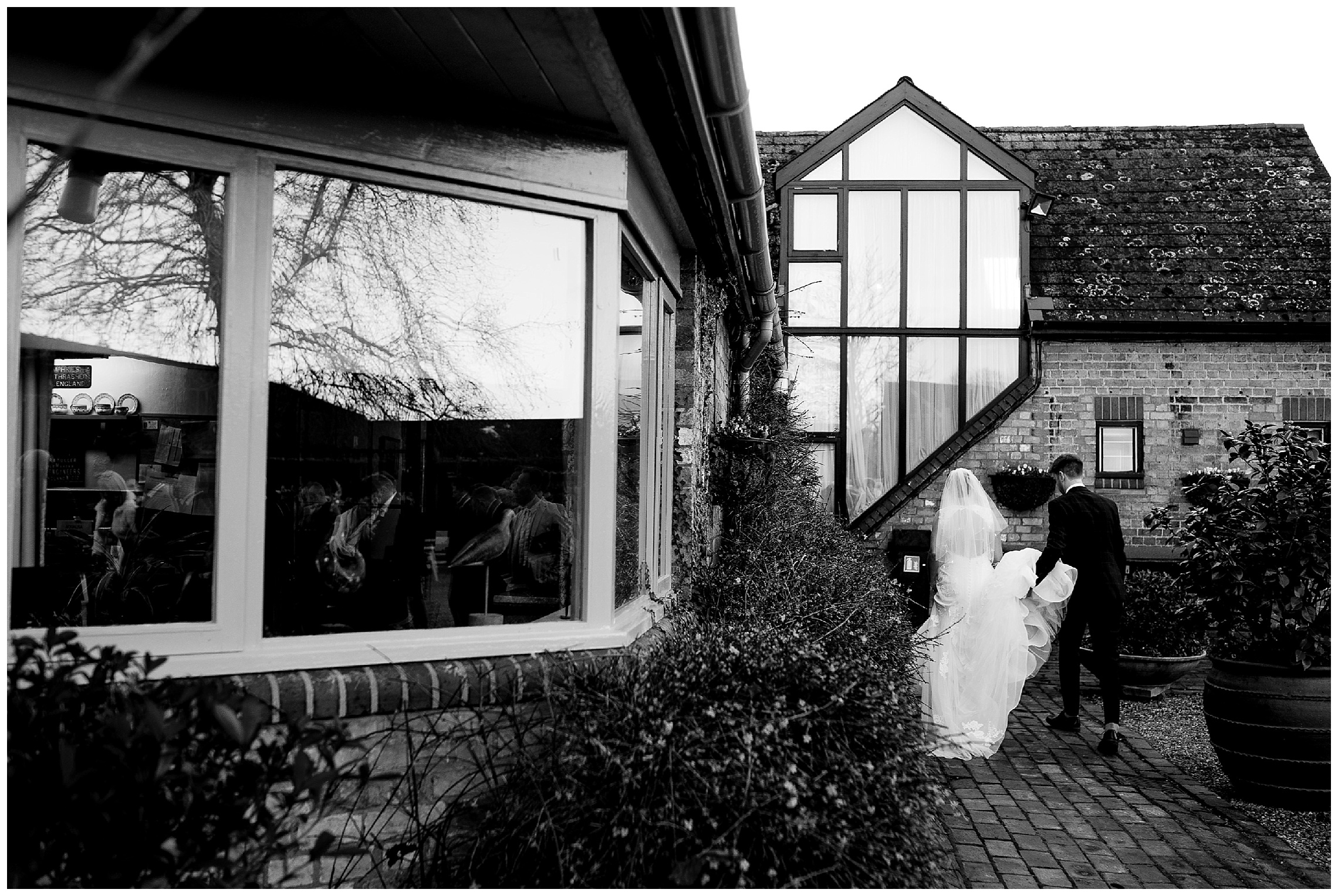 bride and groom walk together at south farm