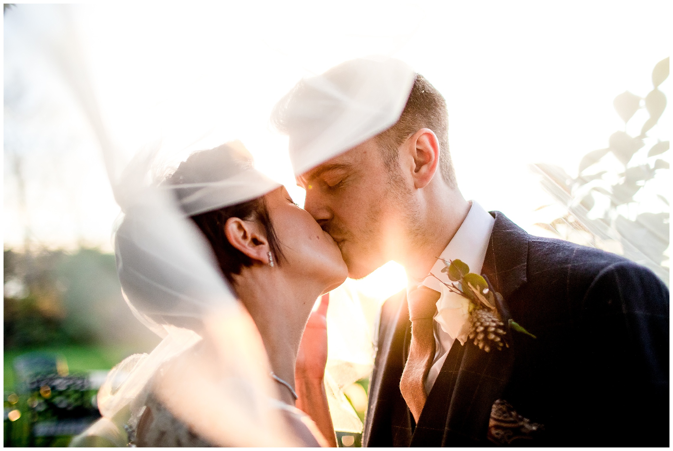 bride and groom kiss under the veil at south farm