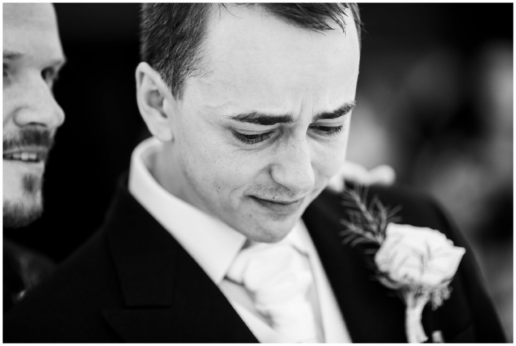 Groom emotional as his best man reassures him crying 