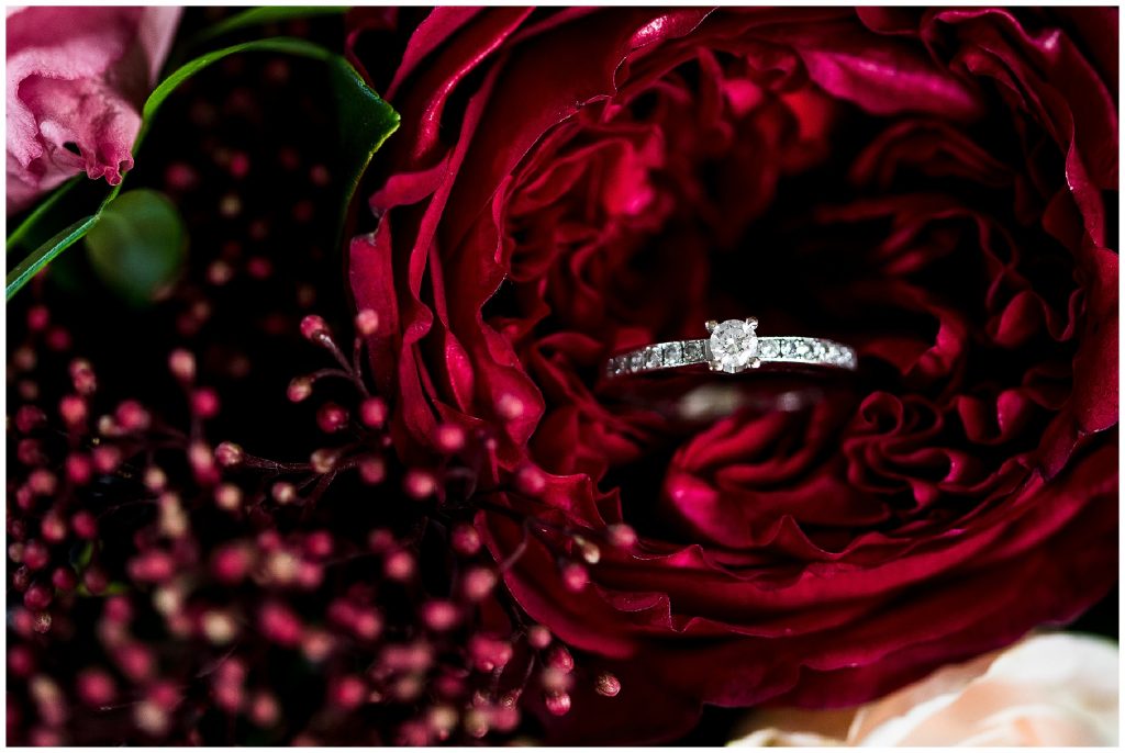 brides diamond engagement ring in red rose 