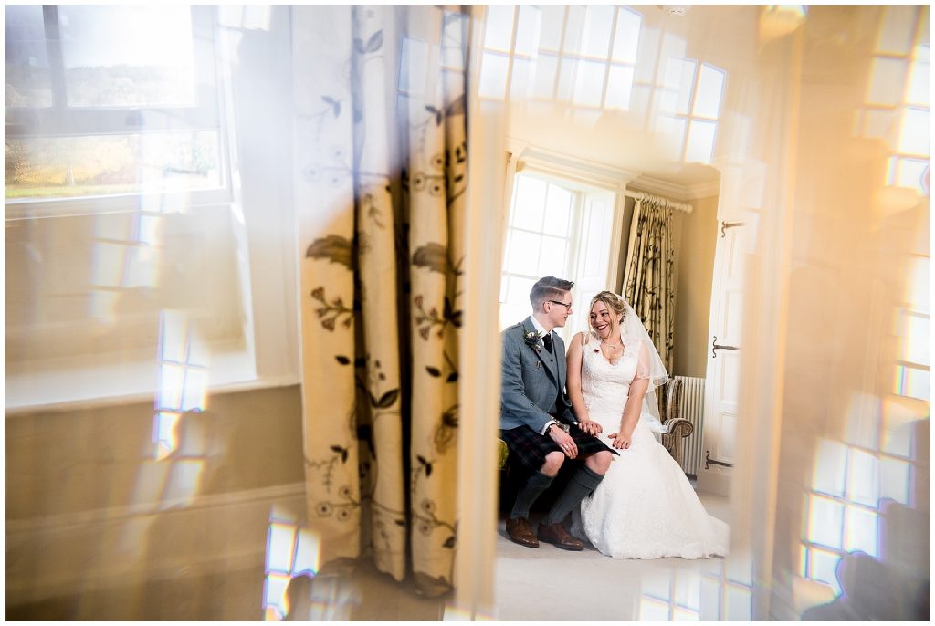 bride and groom talk in the bridal suite 