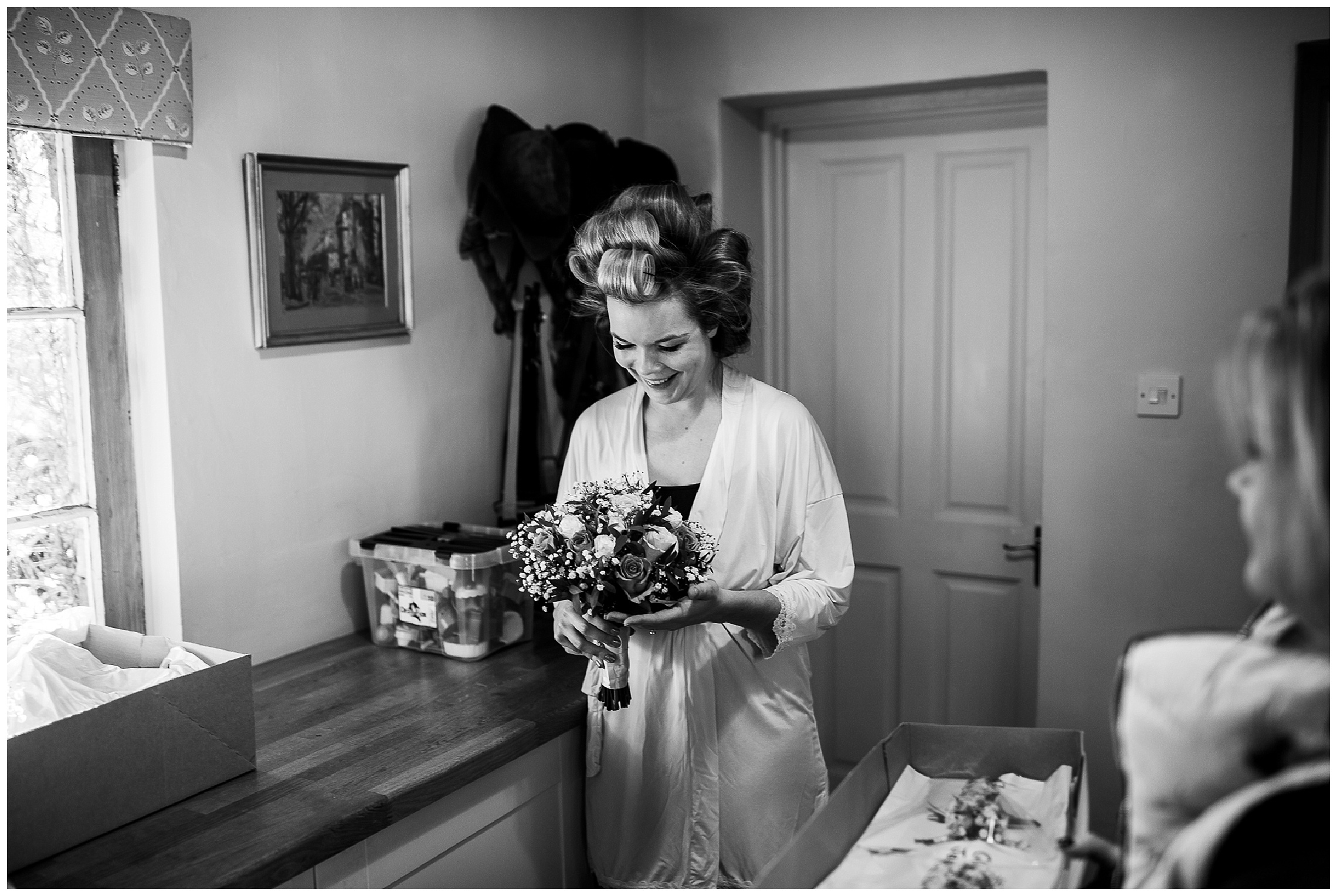 bride looks at her wedding flowers