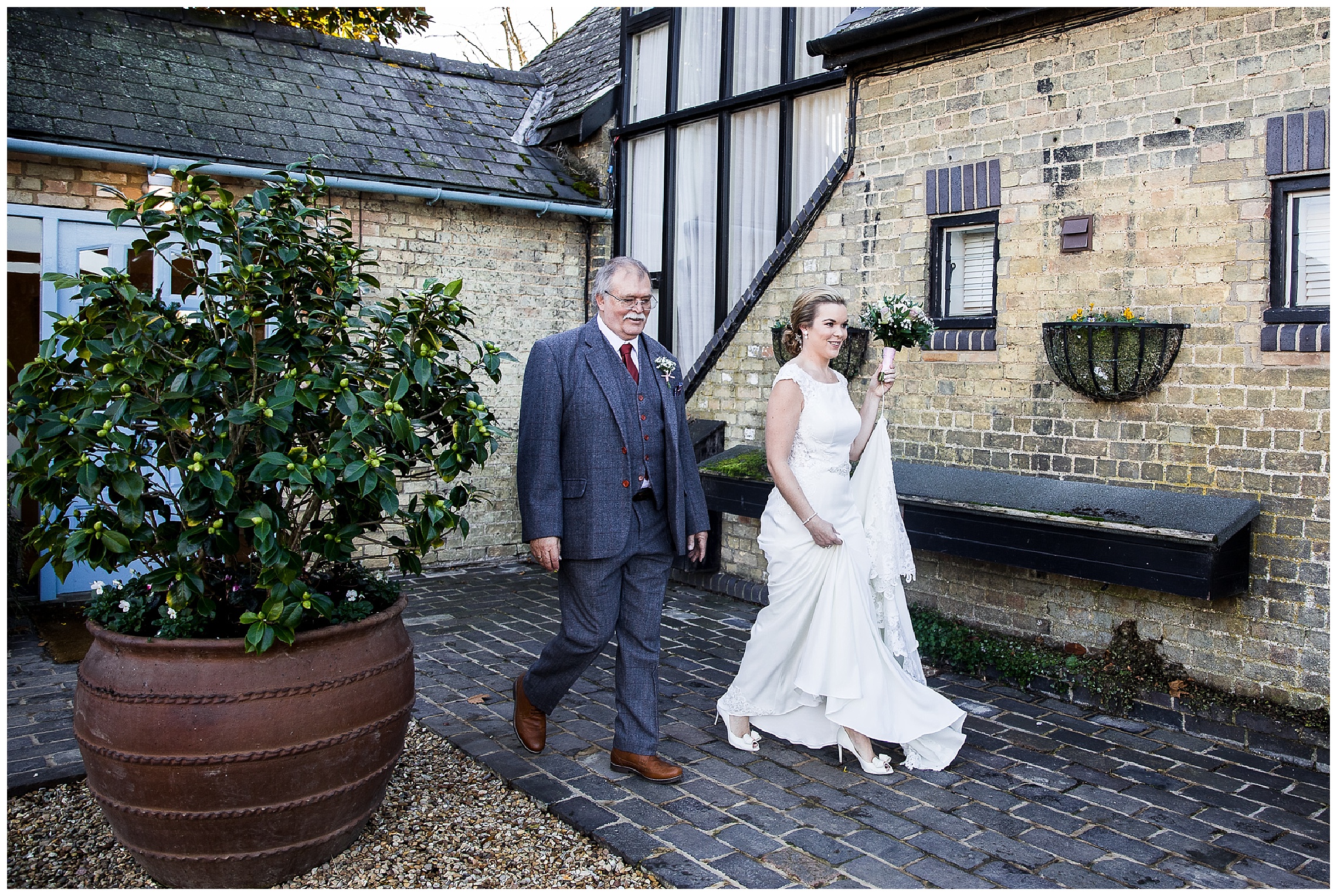 Bride and brides father walking to wedding ceremony