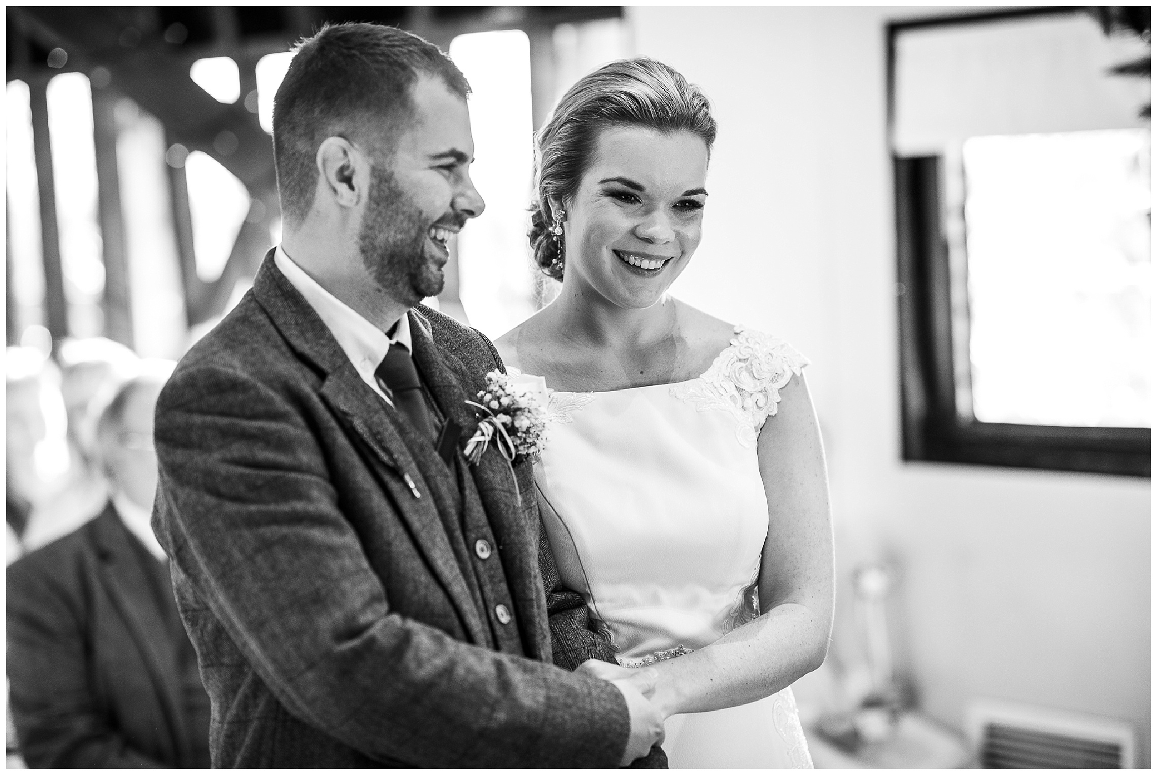 bride and groom at wedding ceremony smiling