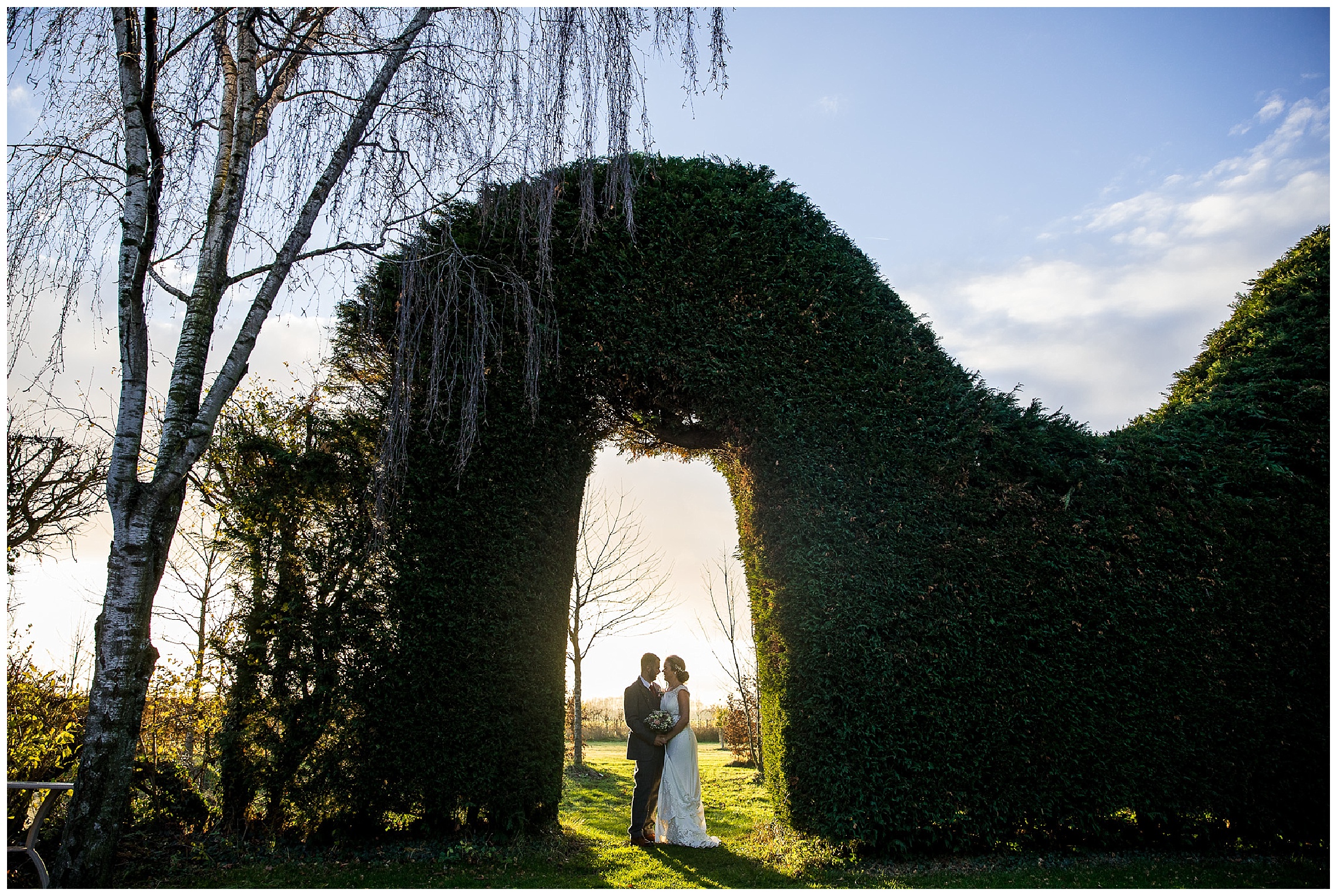 bride and groom at golden hour as sun goes down