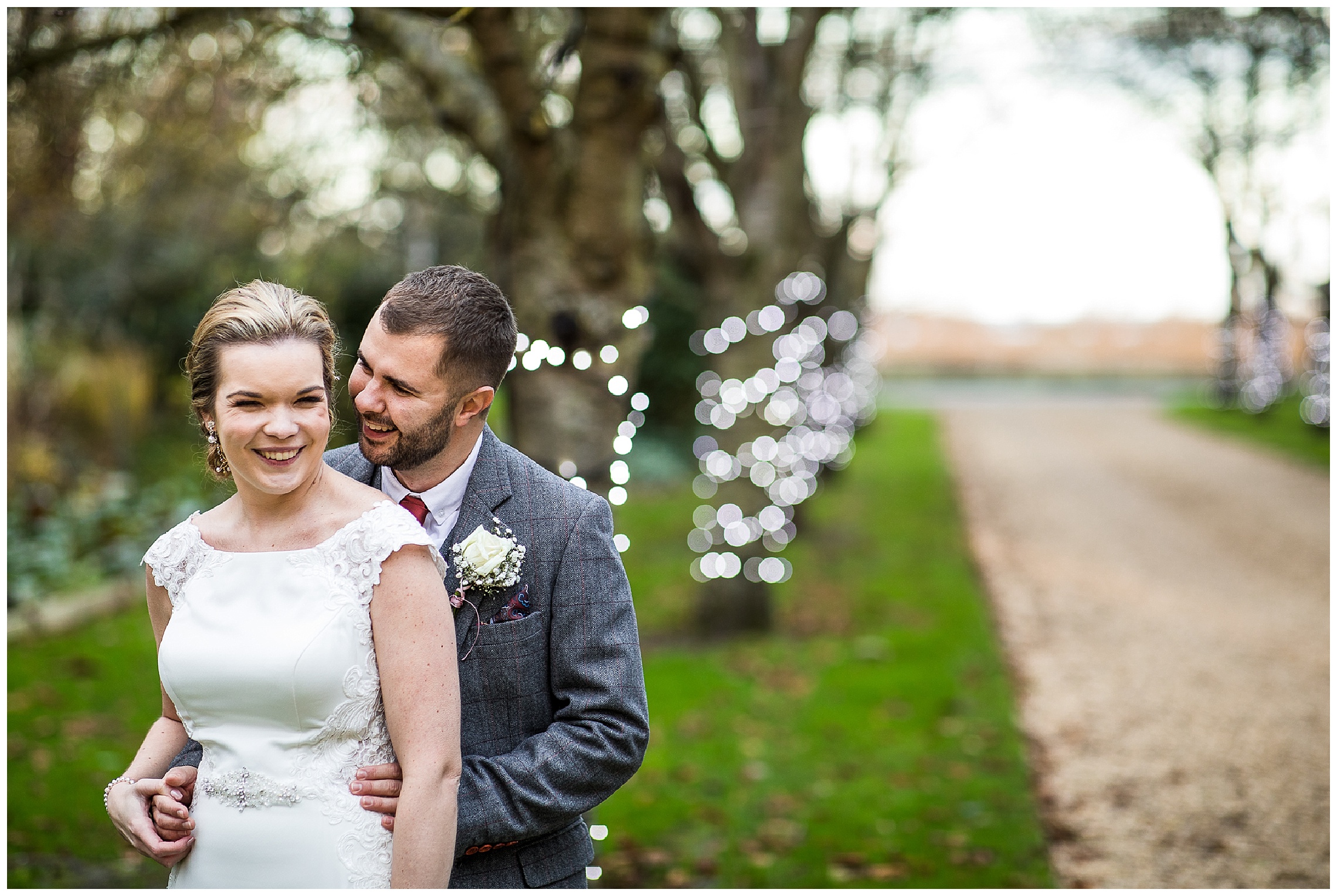 bride and groom laughing together on driveway at south farm