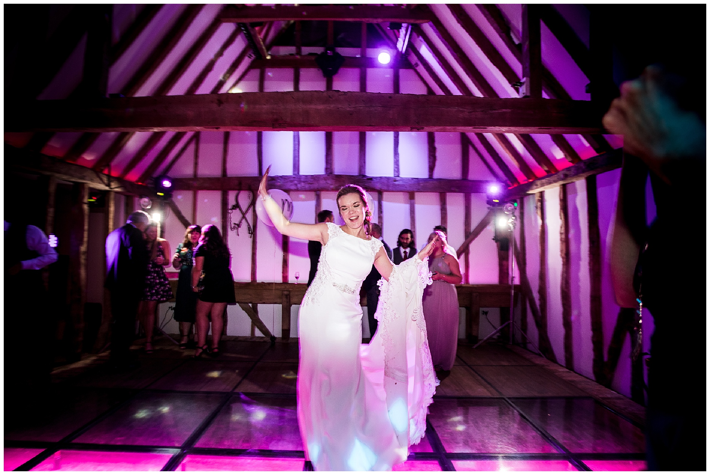 Bride dancing alone on dance floor