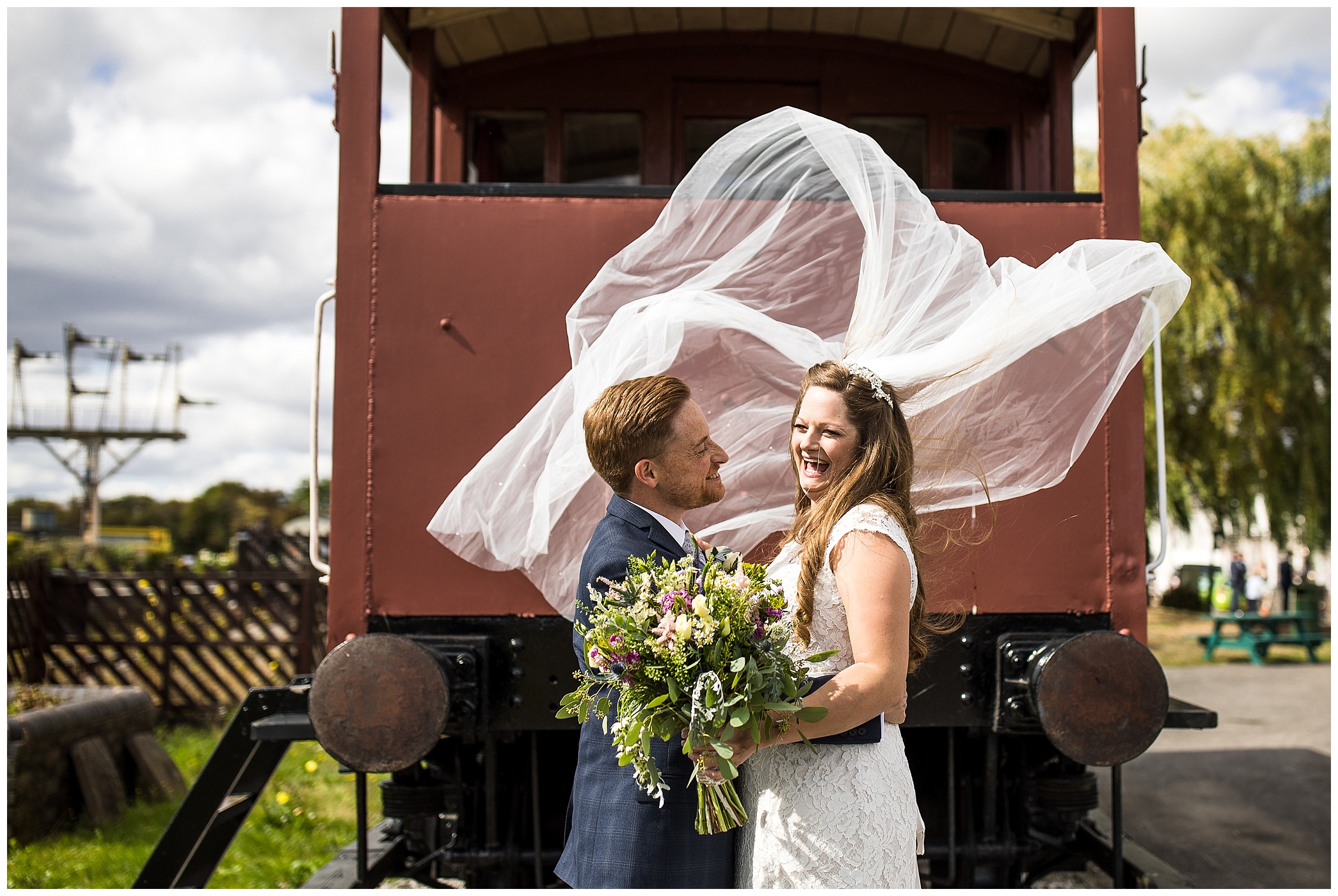 brides veil blows high in wind at bucks railway centre