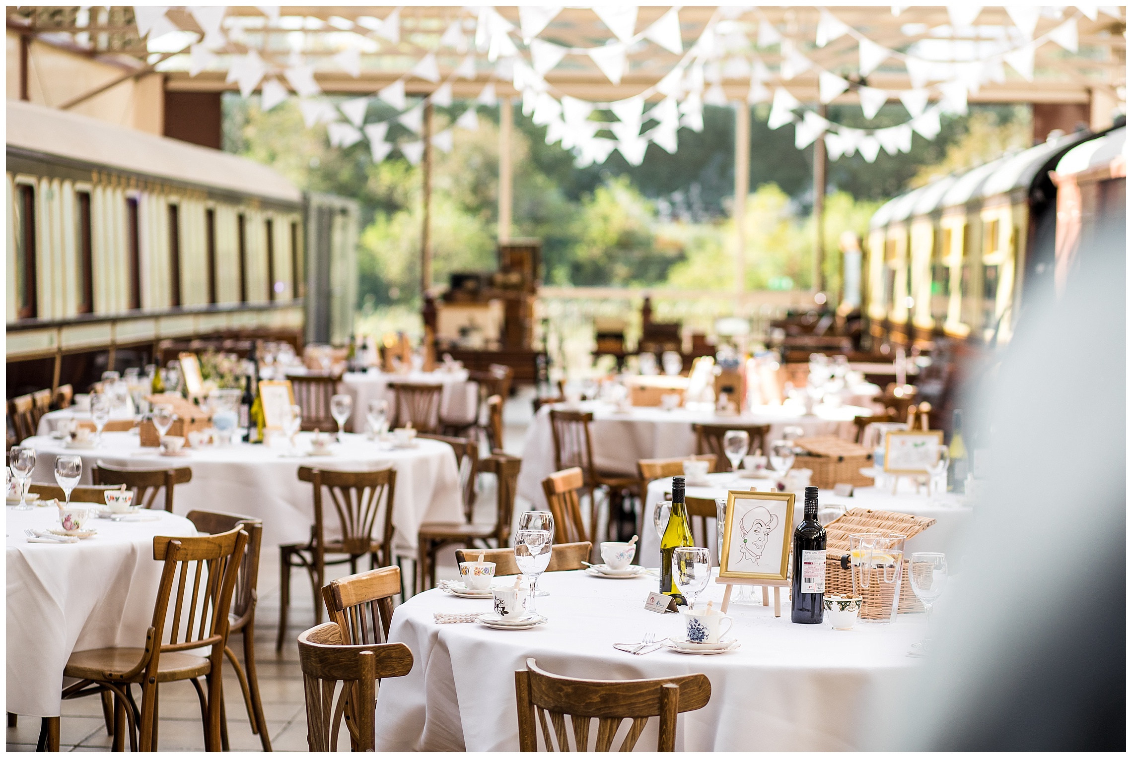 white bunting, wooden chairs and a cinderella disney theme wedding