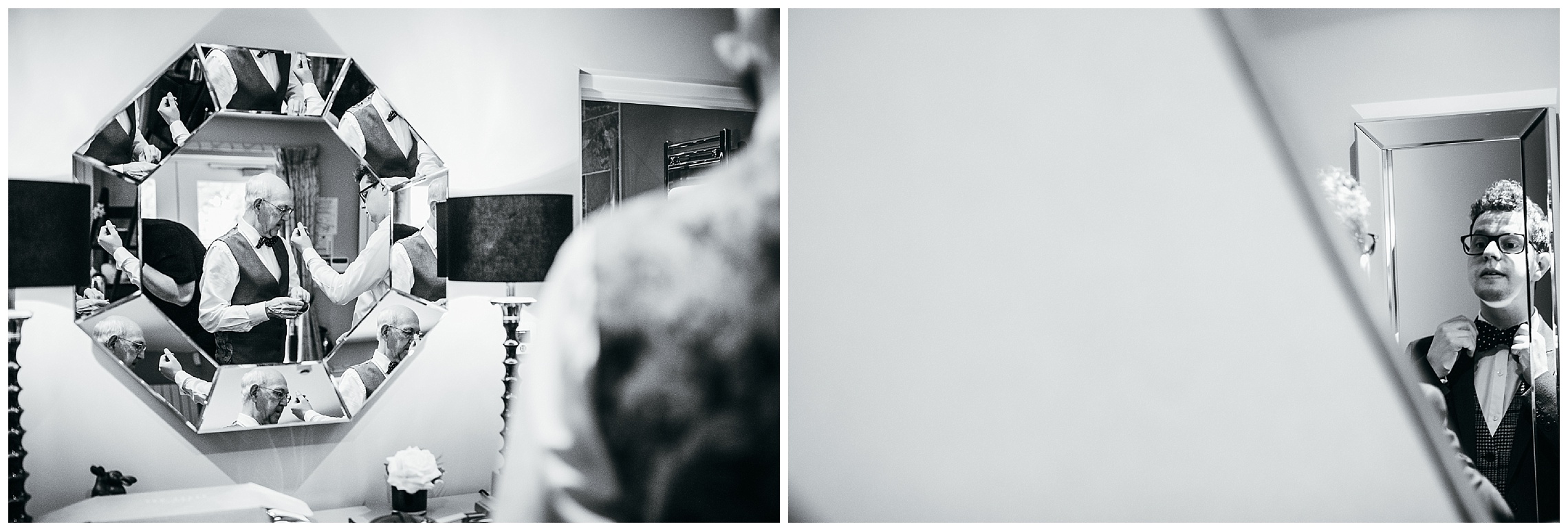 black and white image of groom and father of the groom adjusting bow tie in the mirror