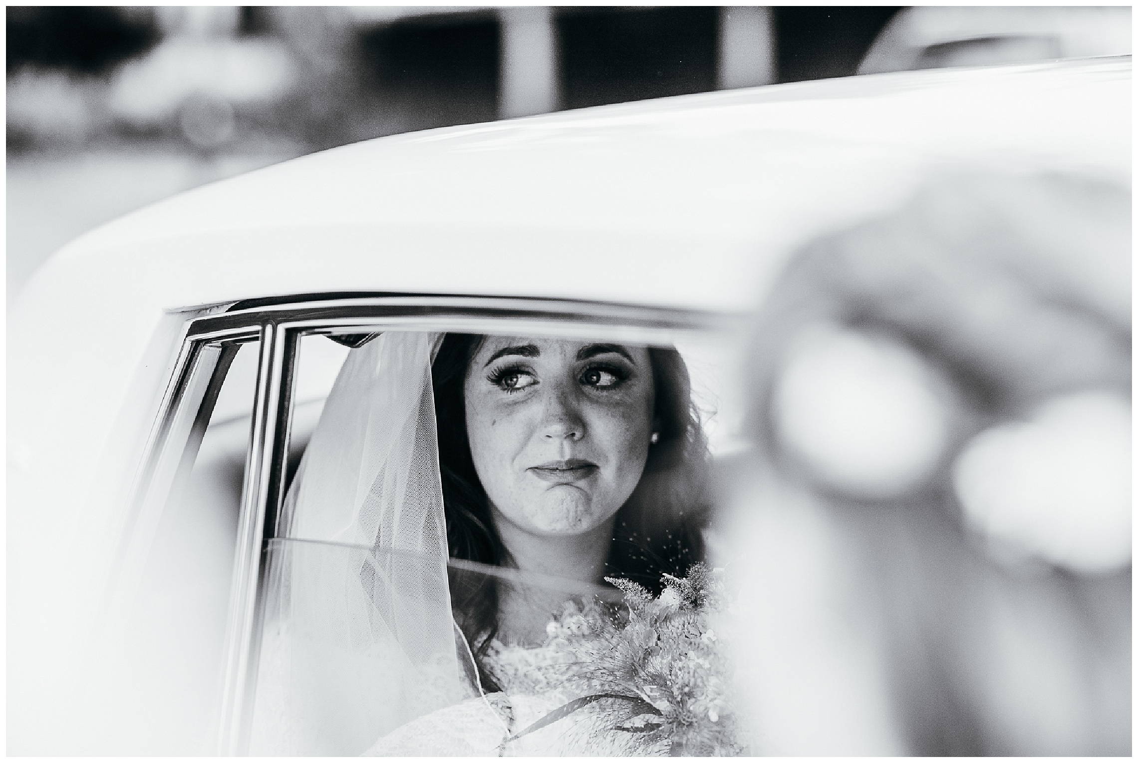 Black and white image of bride waiting to get married and crying emotionally