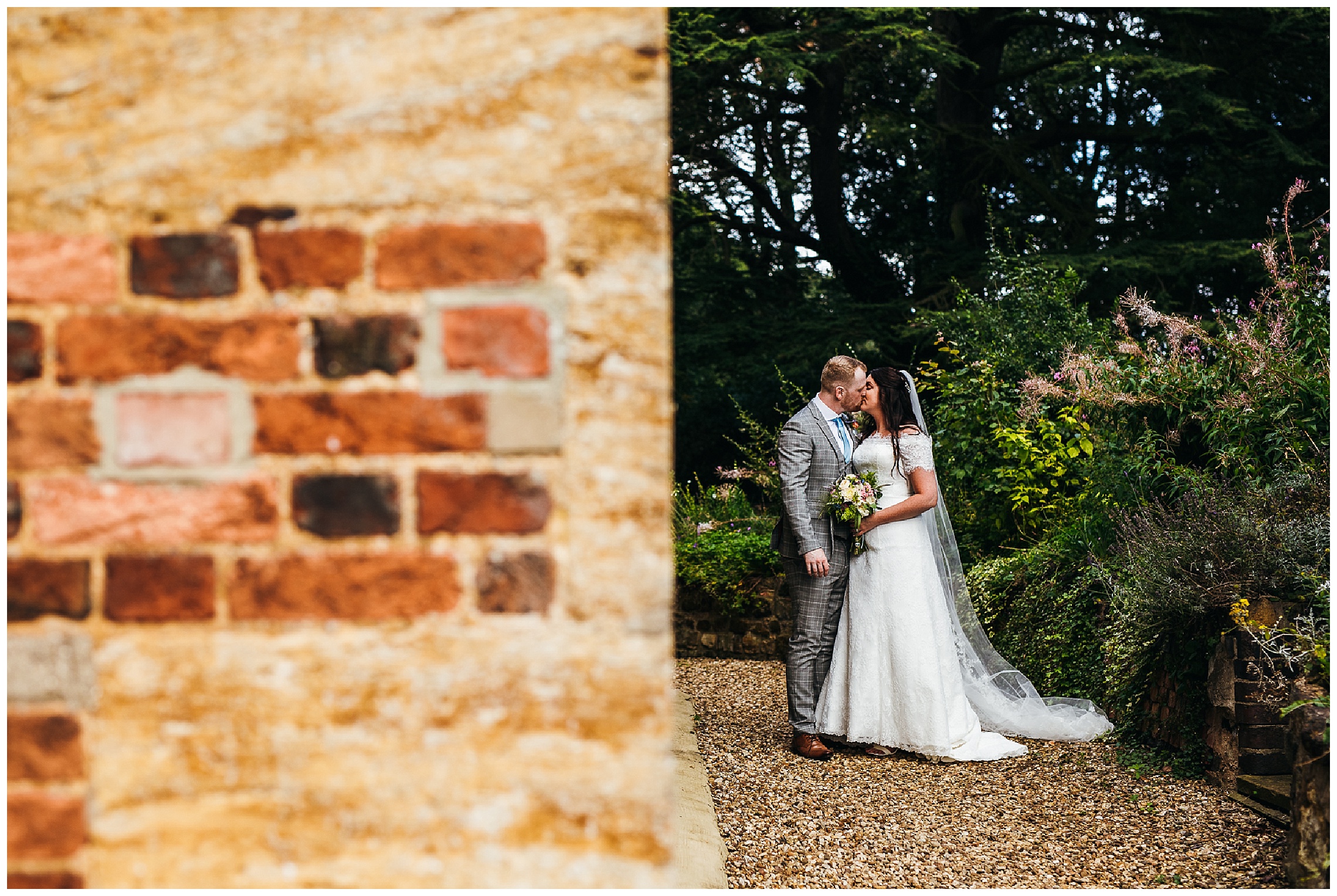 bride and groom kiss