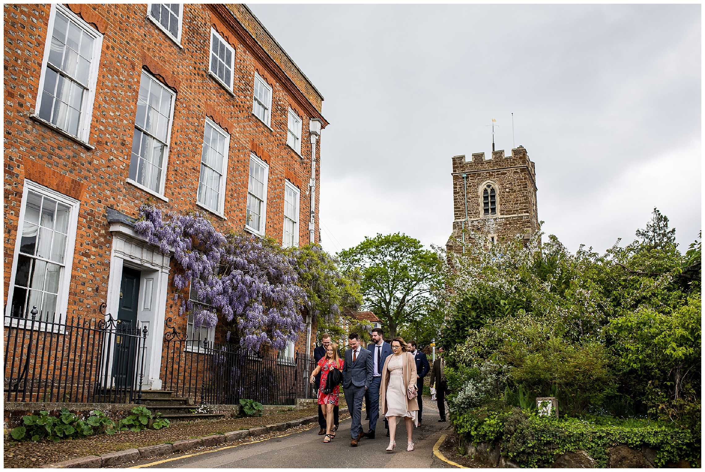 Guests walk away from anthill church on sunny day