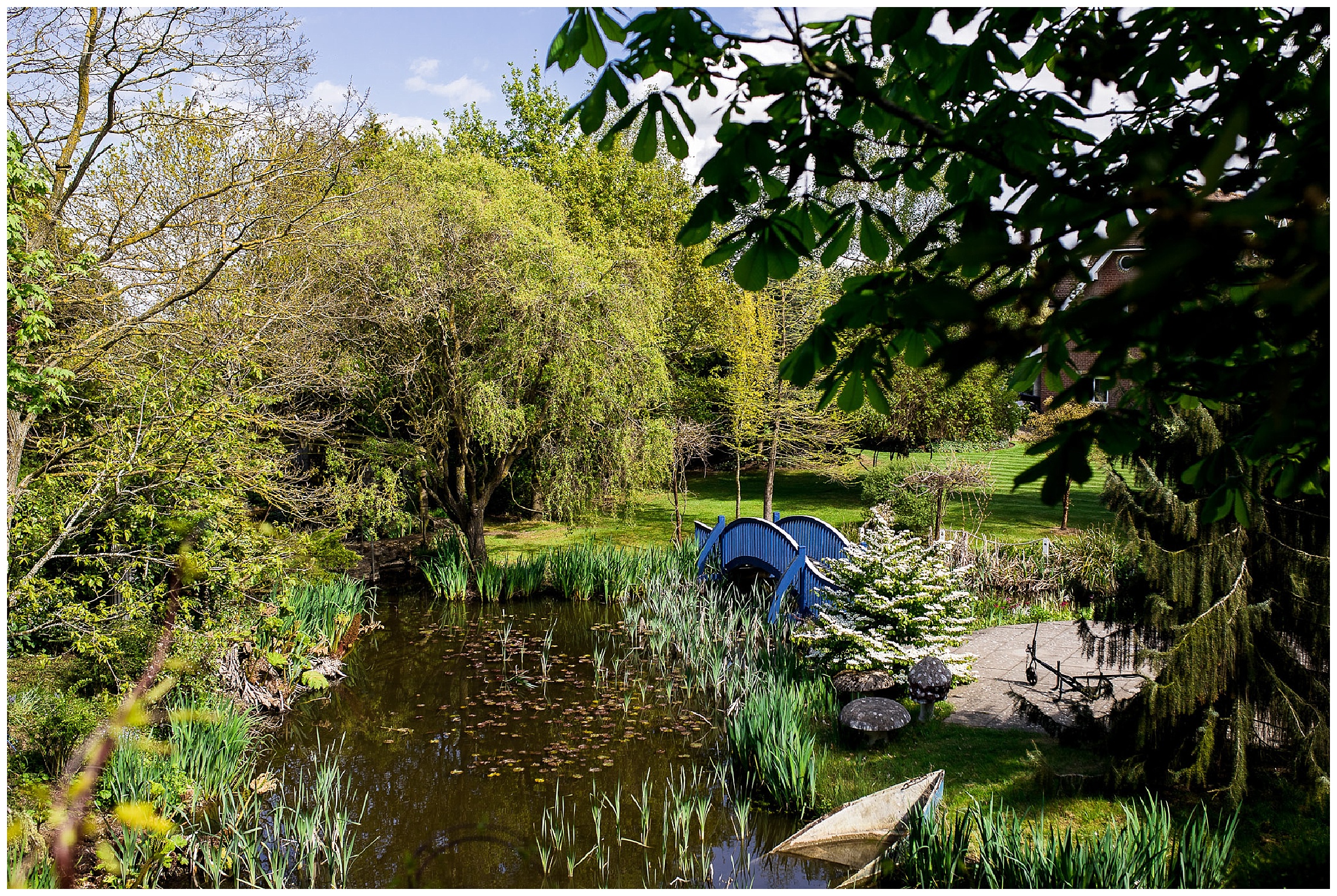 Blue bridge and lake at Flaxbourne Gardens