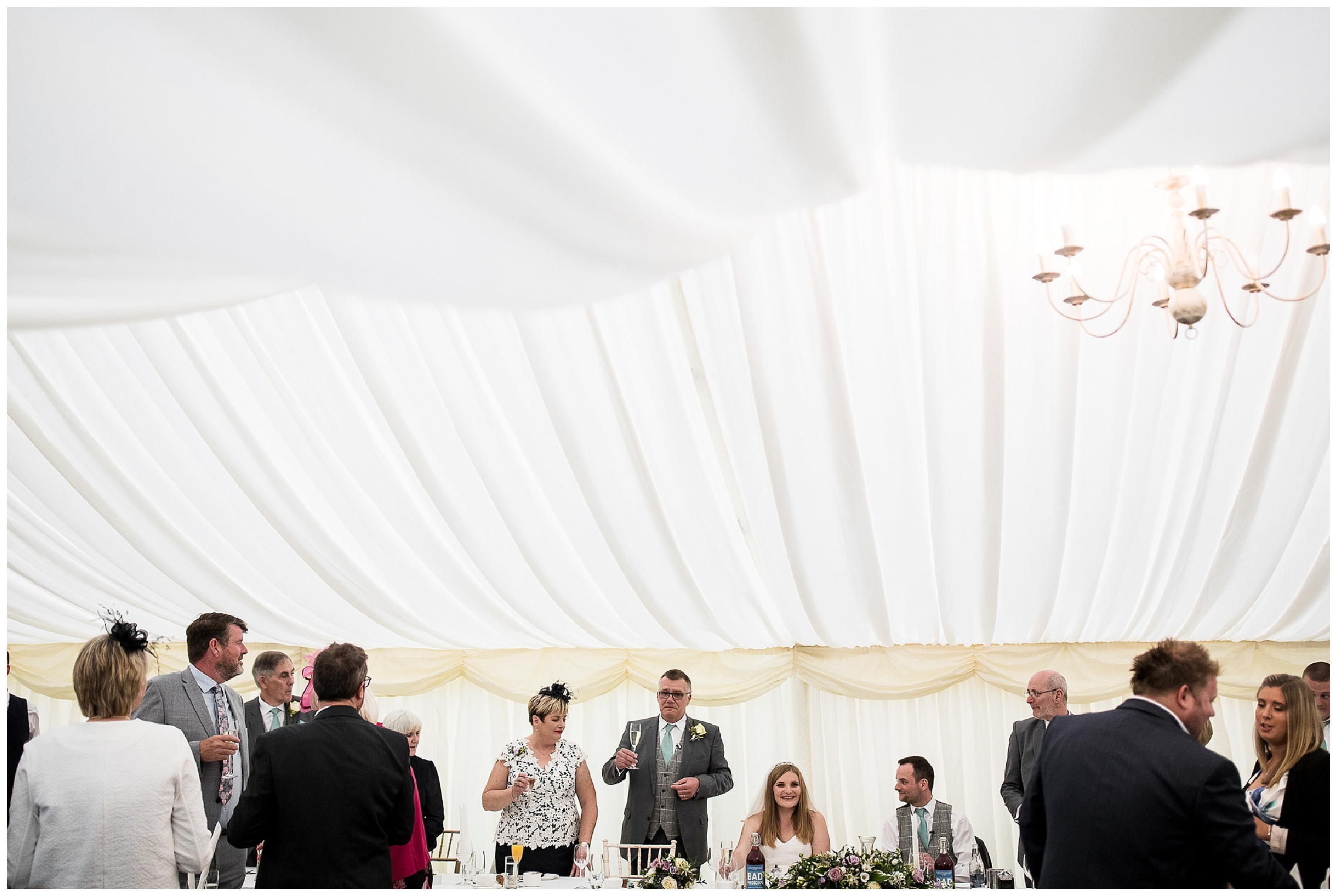 Father of the bride makes speech in white marquee at Flaxbourne