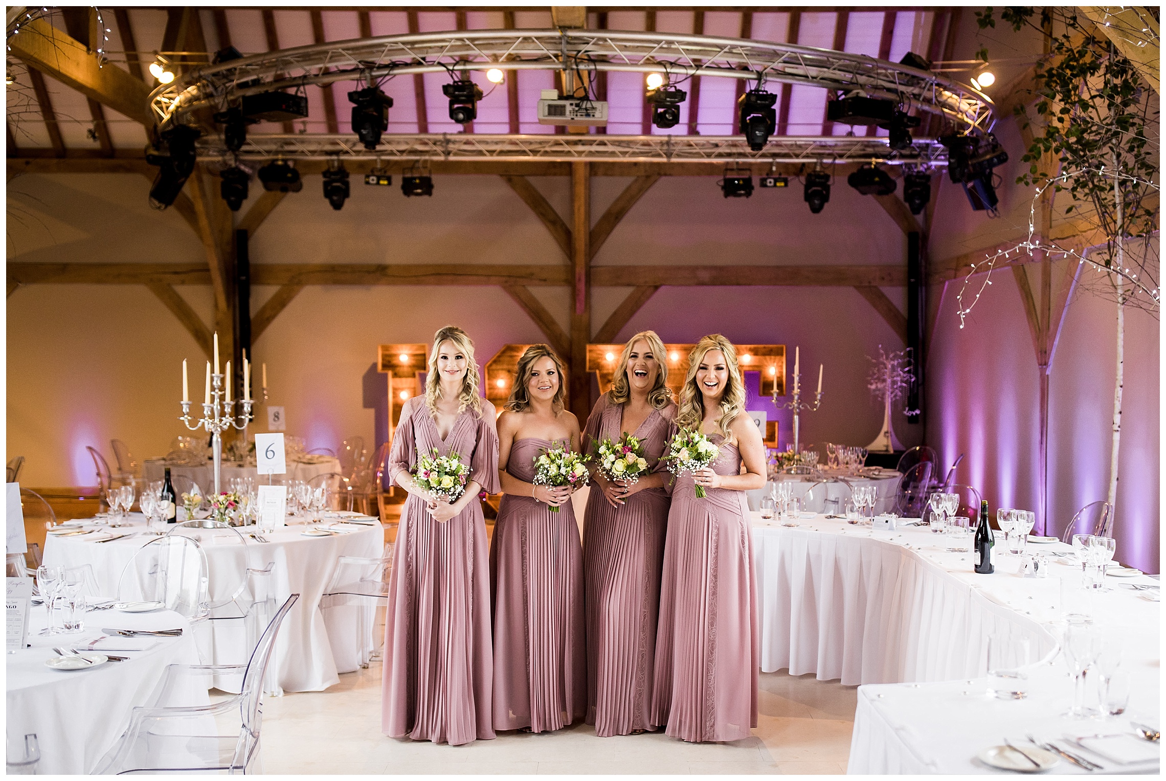 bridesmaids in pink dresses in redhouse barn