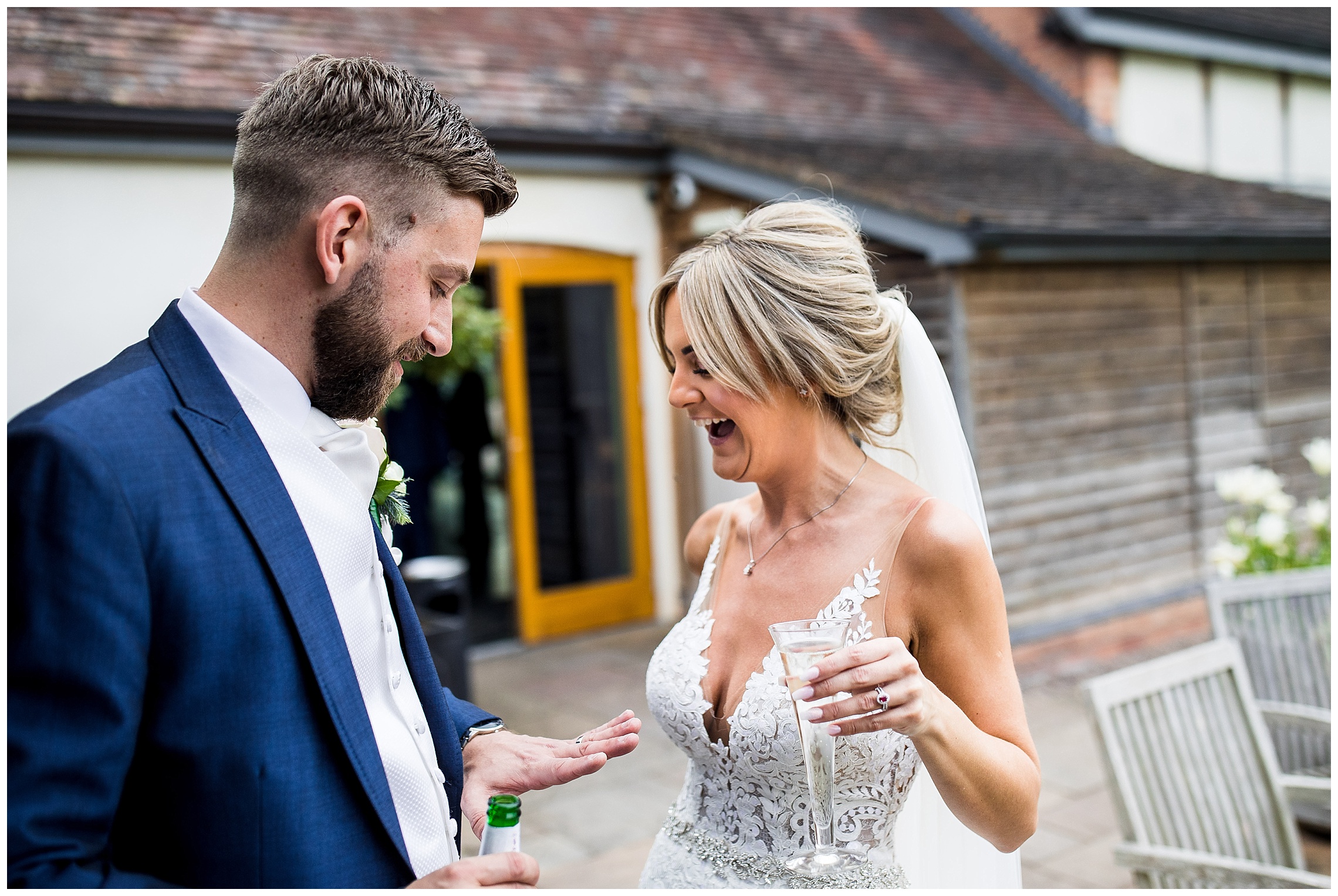 bride and groom looking at wedding rings