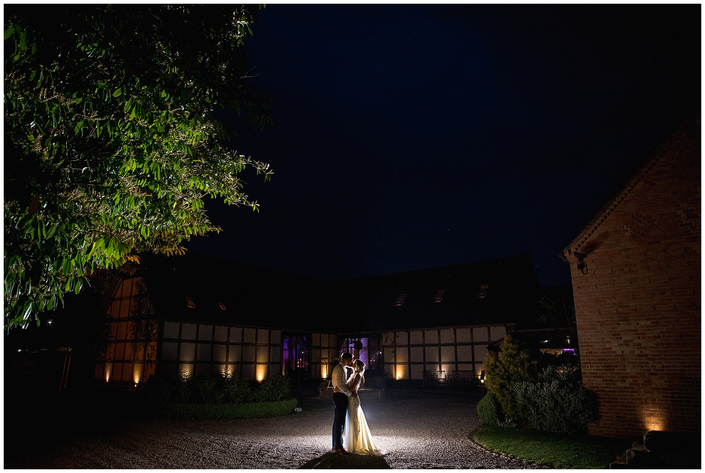 bride and groom in dark at redhouse barn