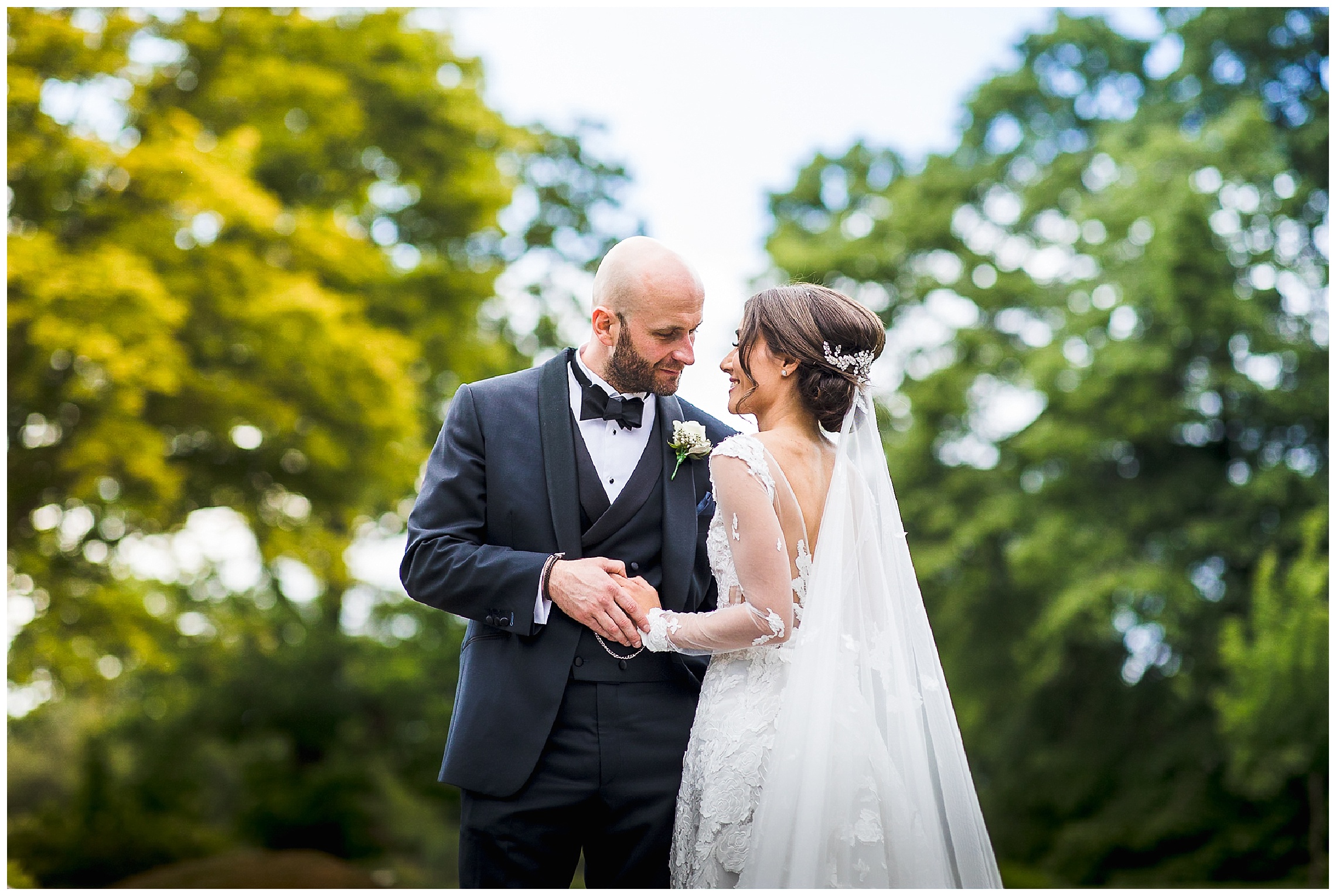 bride and groom hold hands at woburn