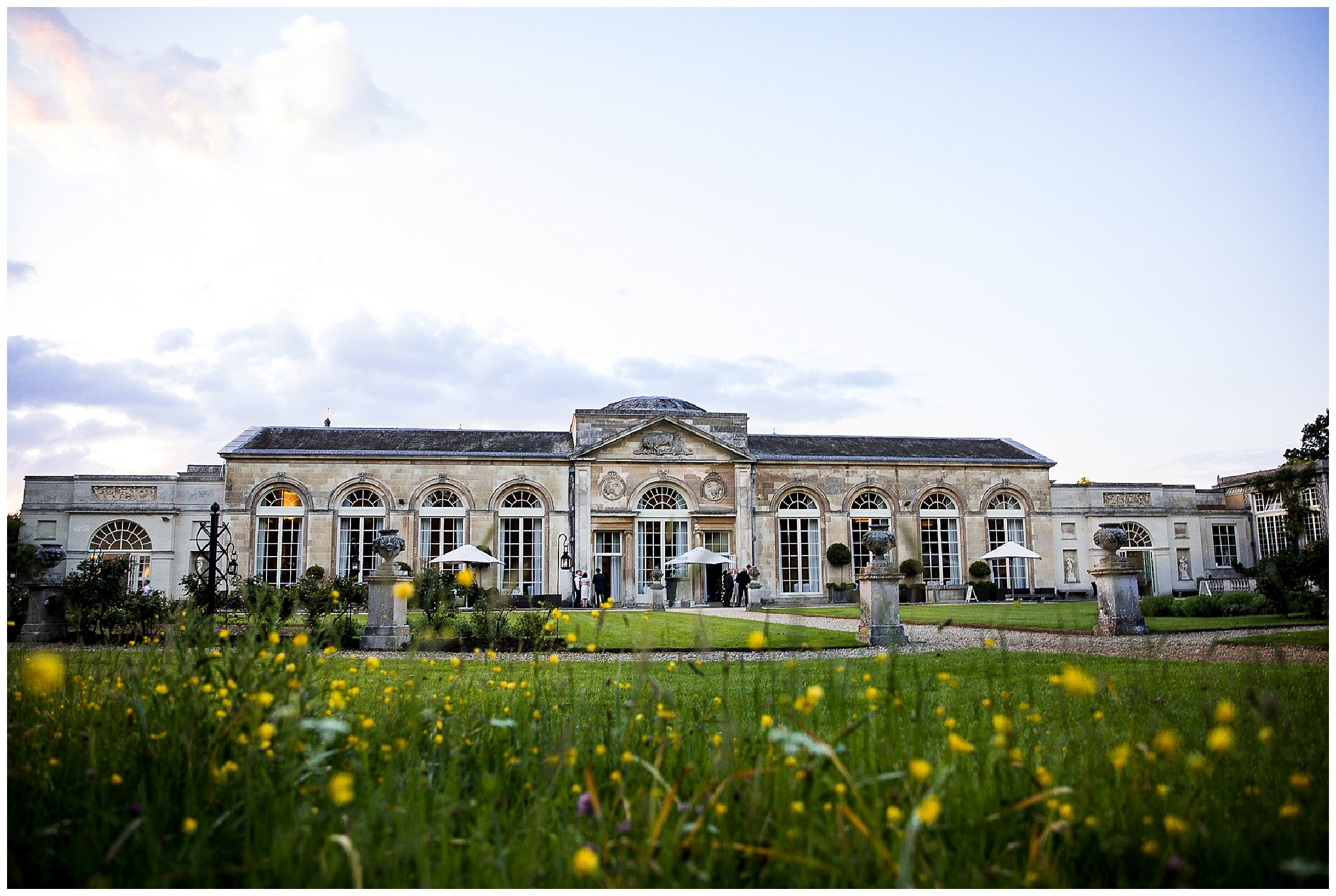 Shot of woburn sculpture gallery with flowers in foreground on sunny day