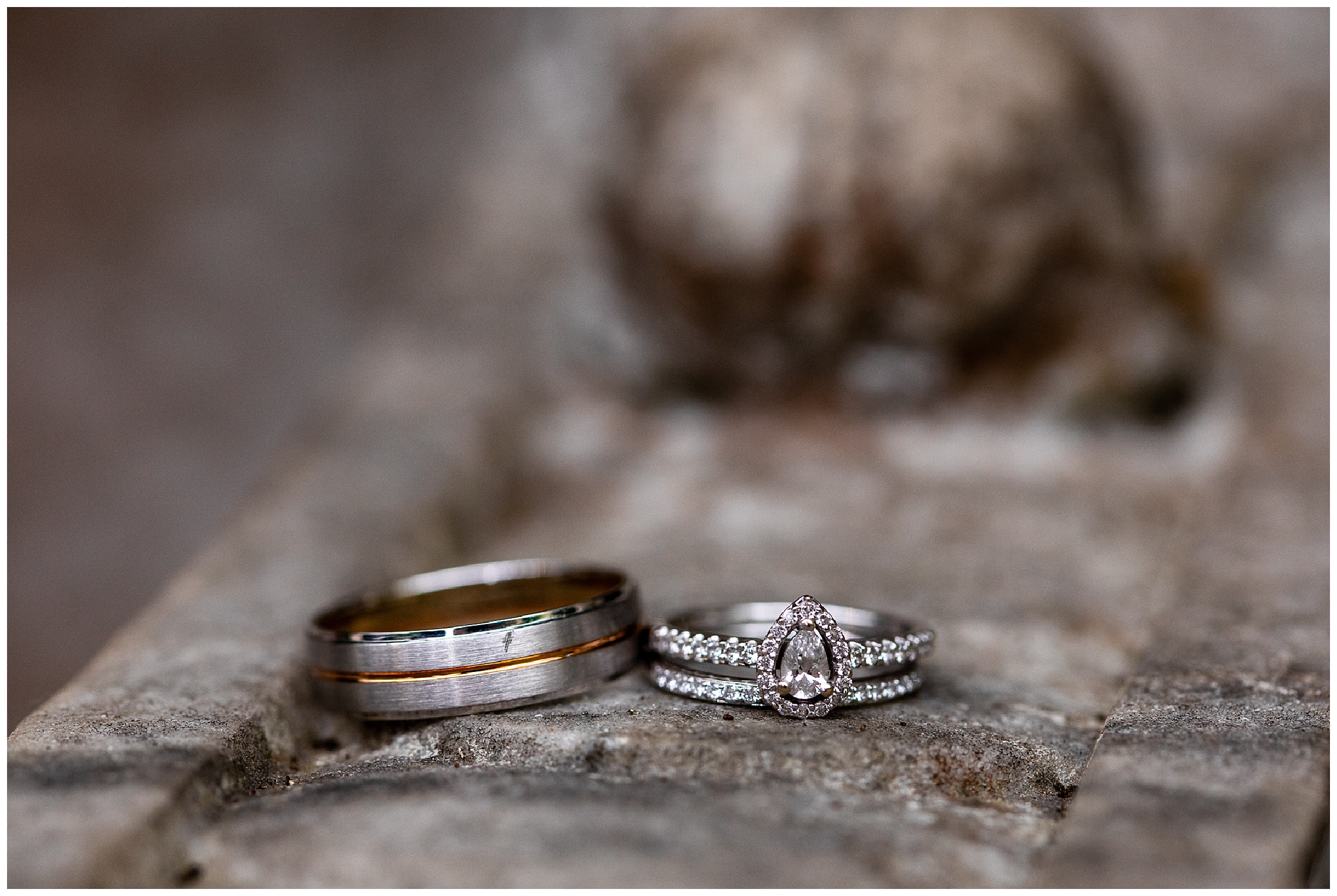 silver and copper wedding rings set on stone