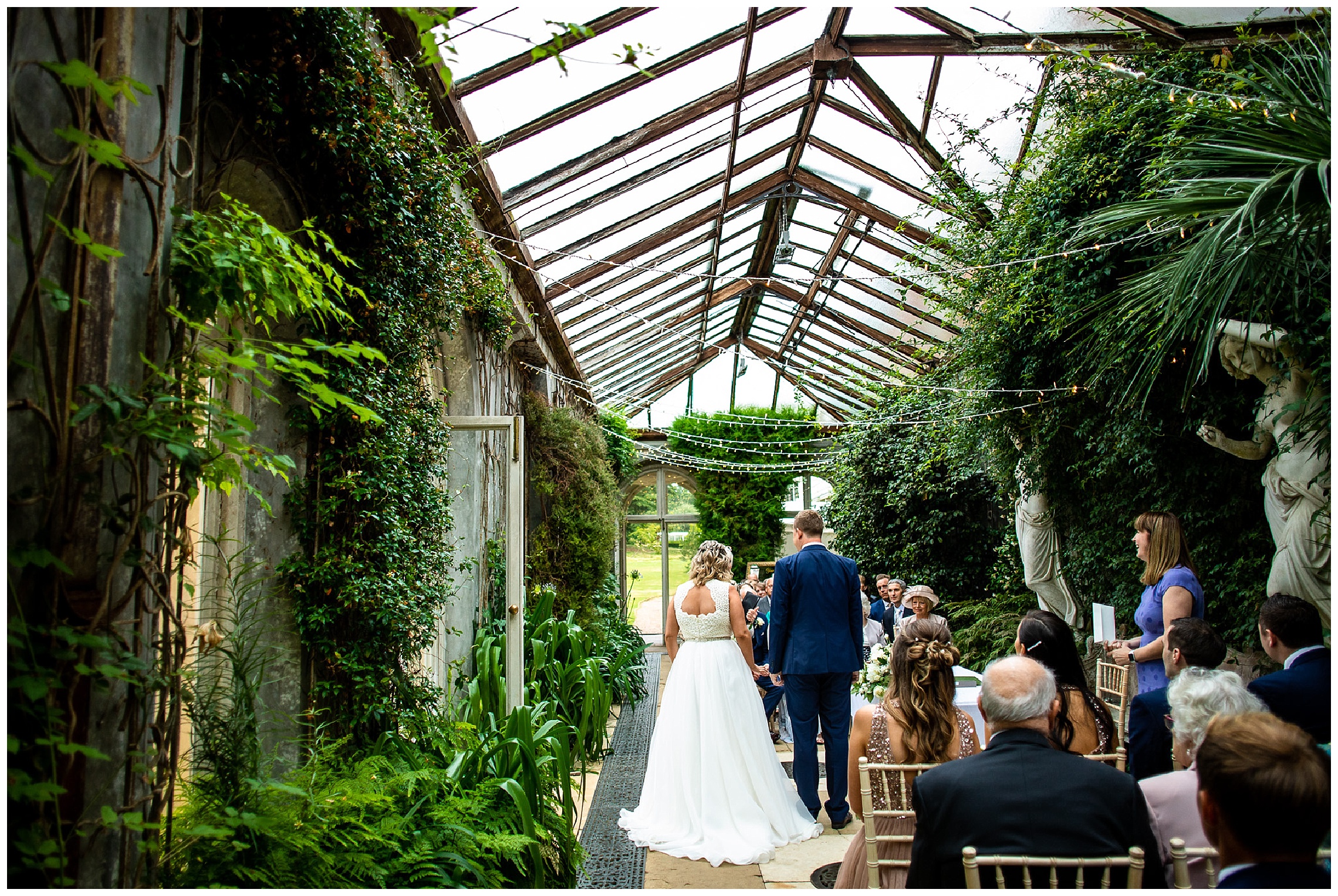 bride and groom in somerleyton hall conservatory
