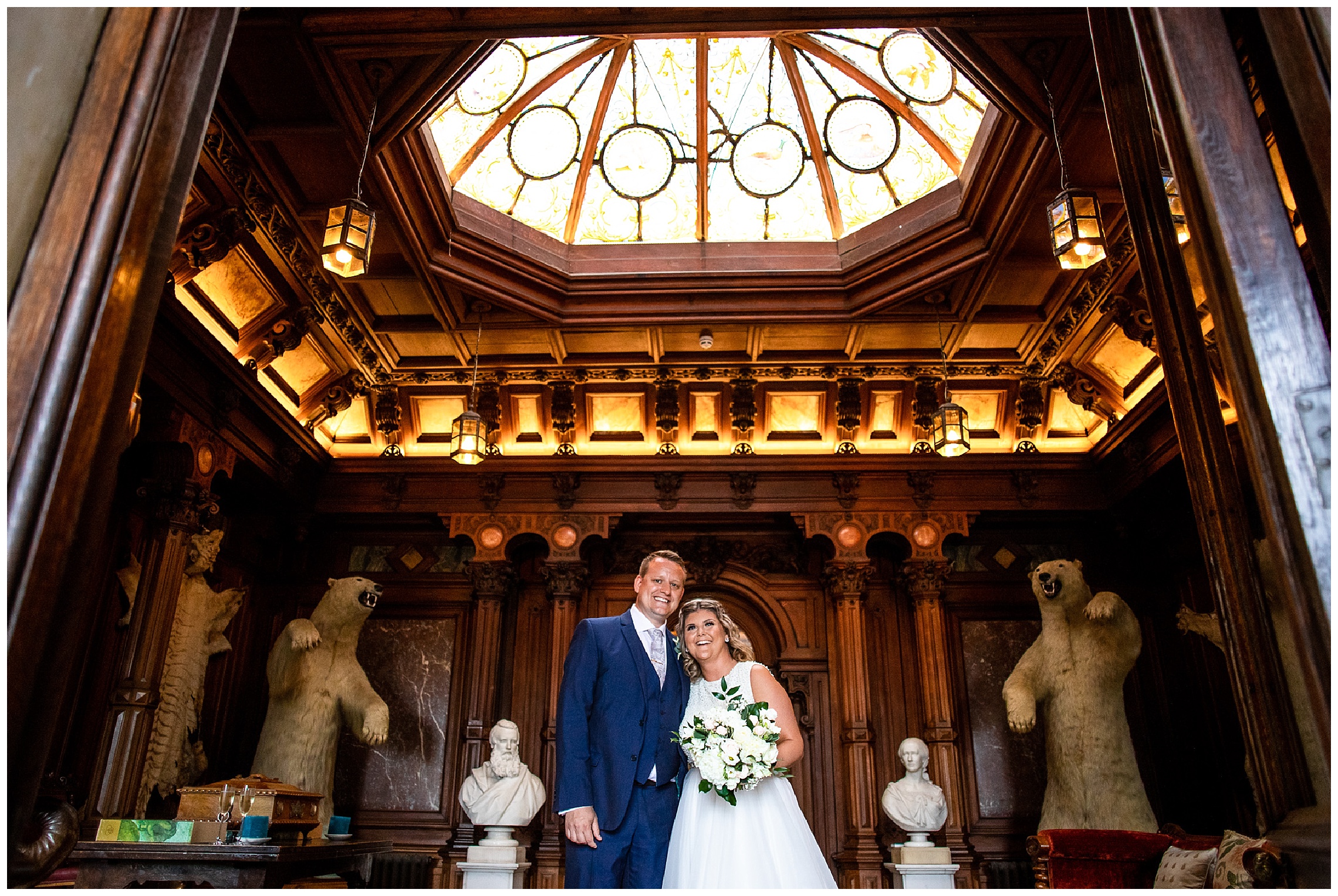 bride and groom at entrance hall of somerleyton