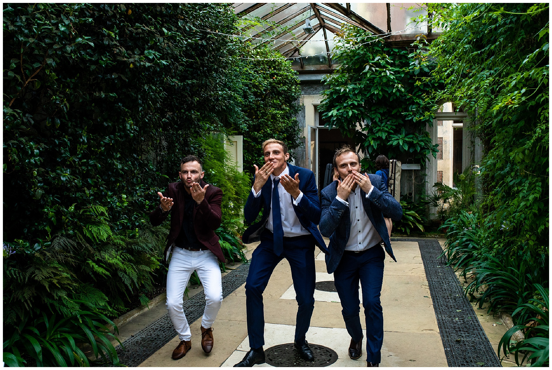 wedding guests walking and blowing kisses