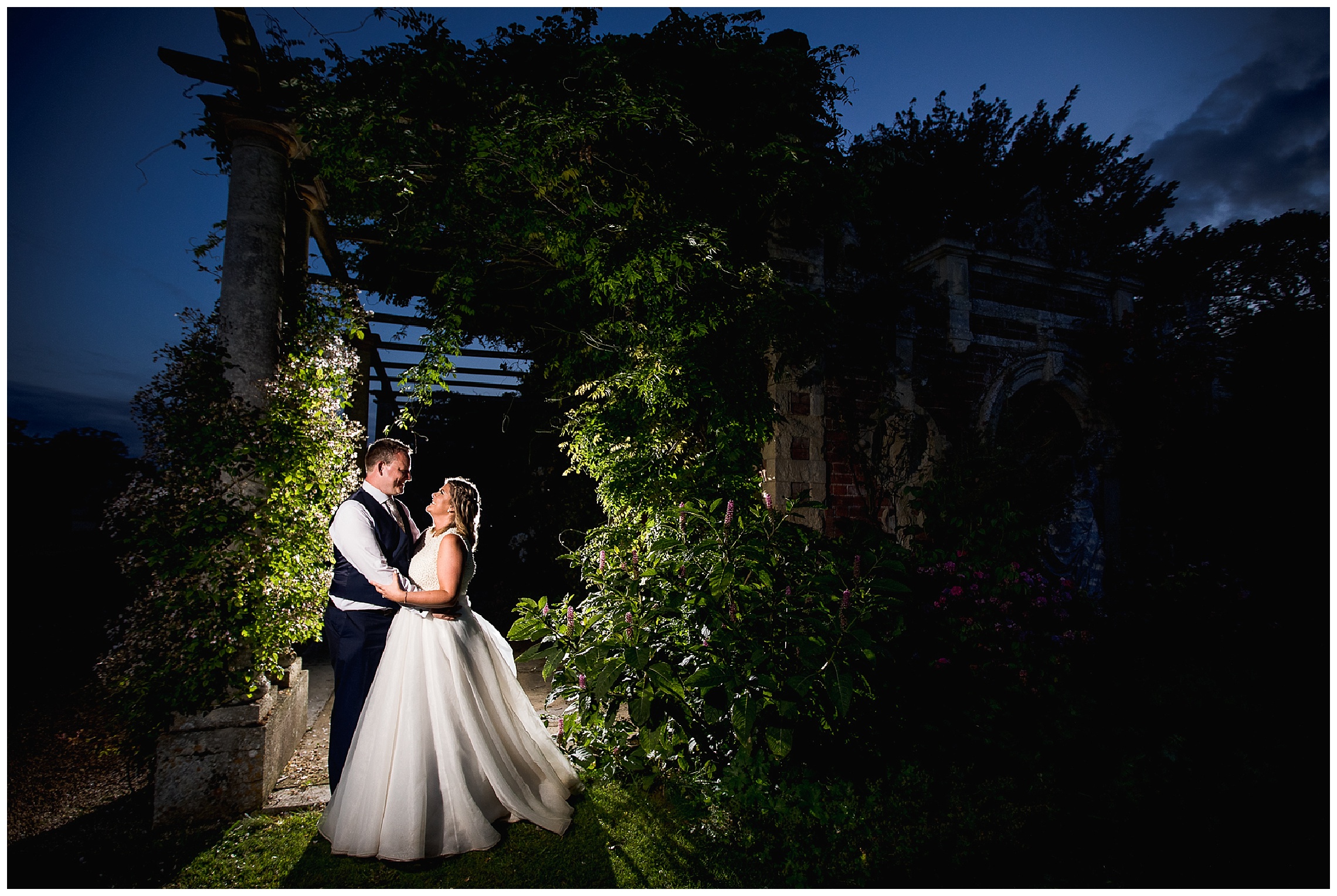 bride and groom in dark at somerleyton hall