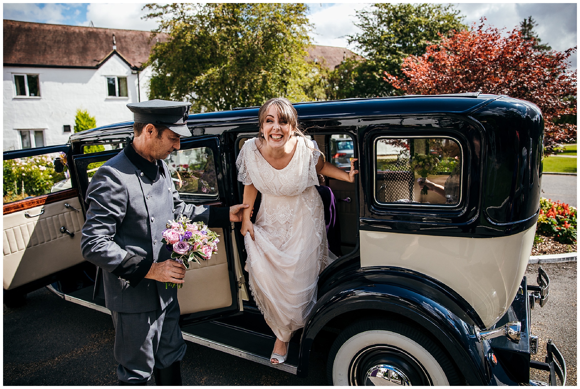 bride getting out of black and white vintage wedding car at barns hotel