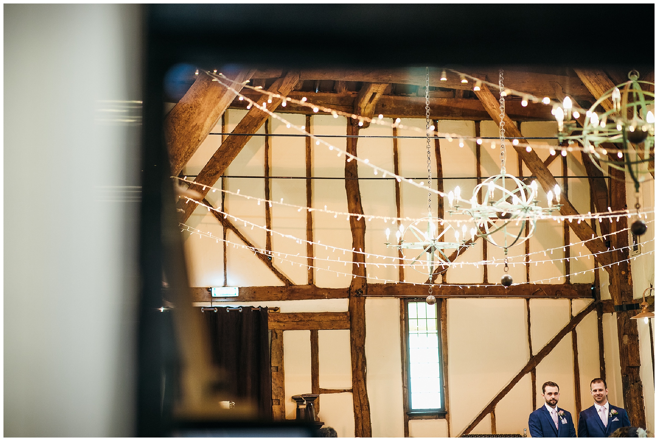 groom stood in empty barn venue