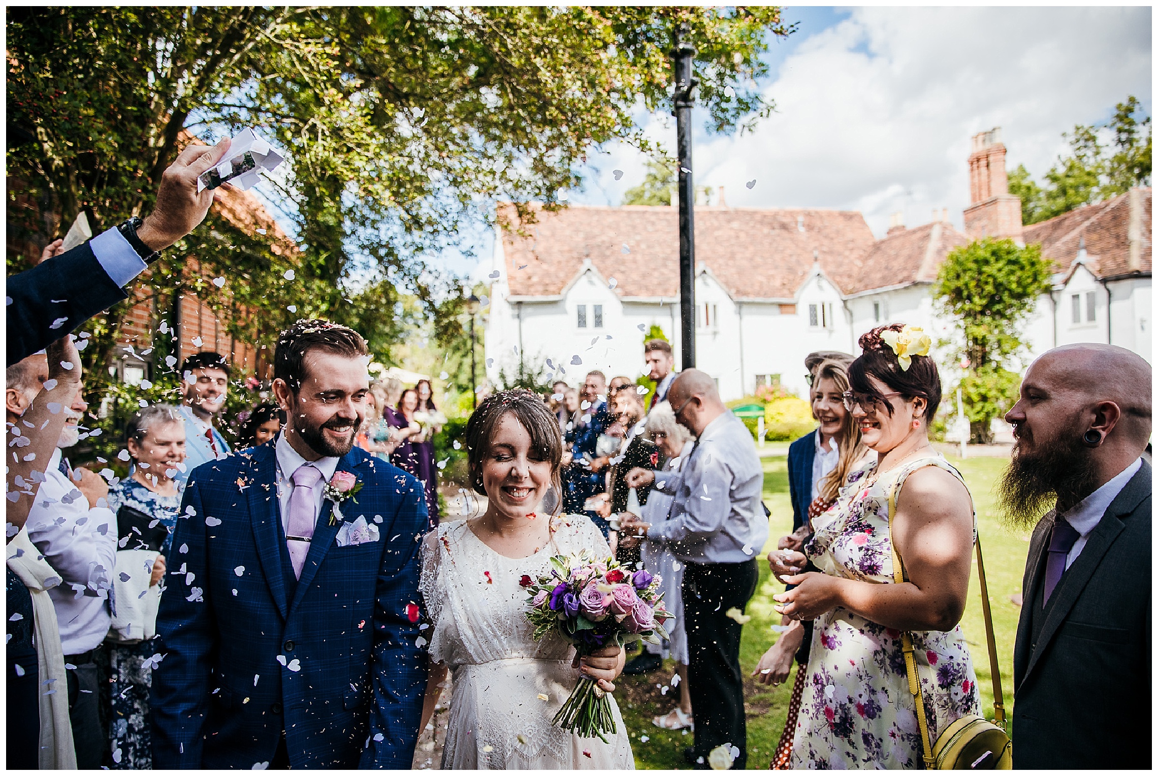 confetti throwing with petals on sunny day