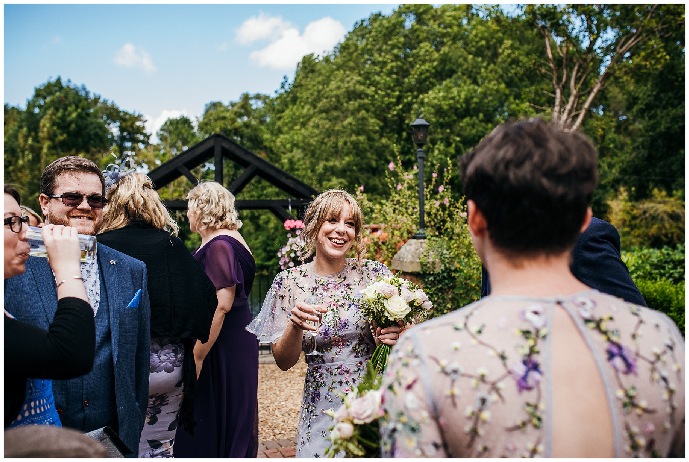 candid photograph of bridesmaid having fun