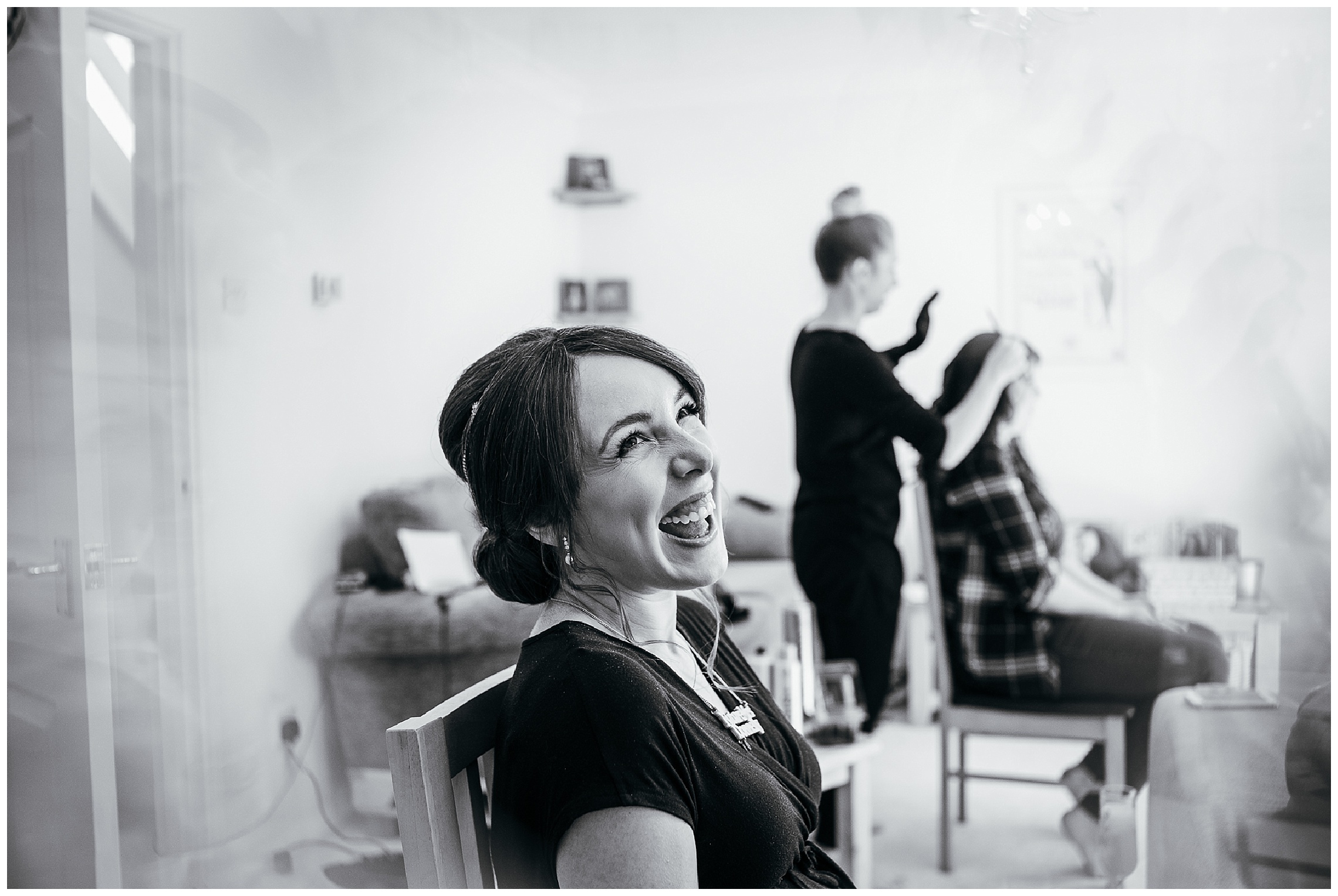 black and white image of bride laughing