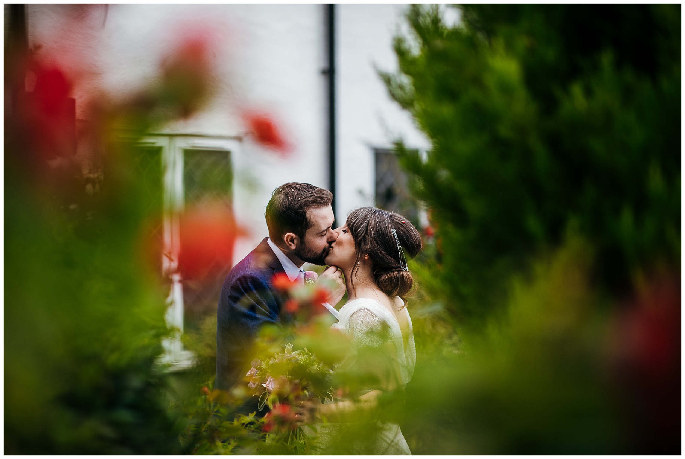 bride and groom kiss