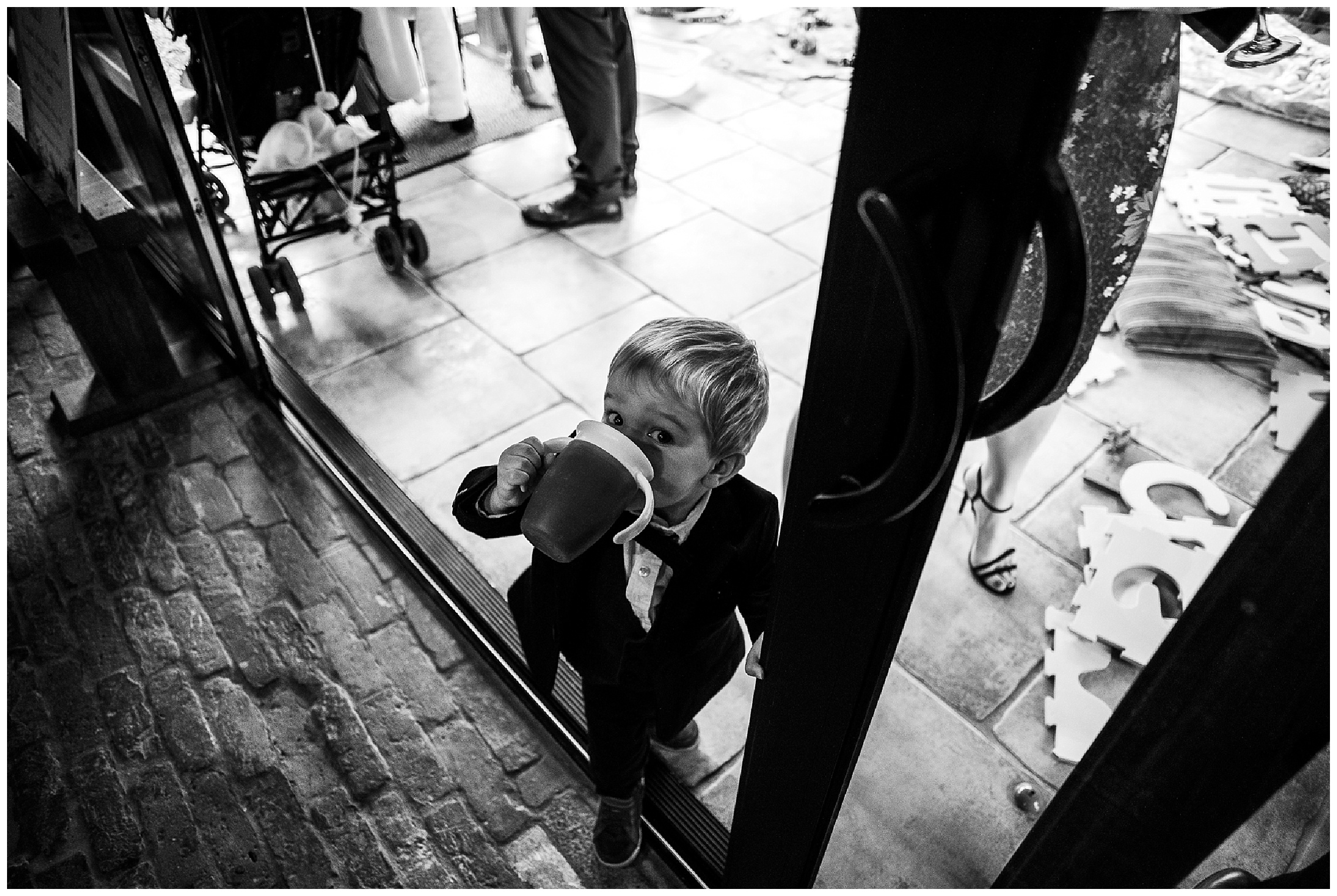 child drinks from cup