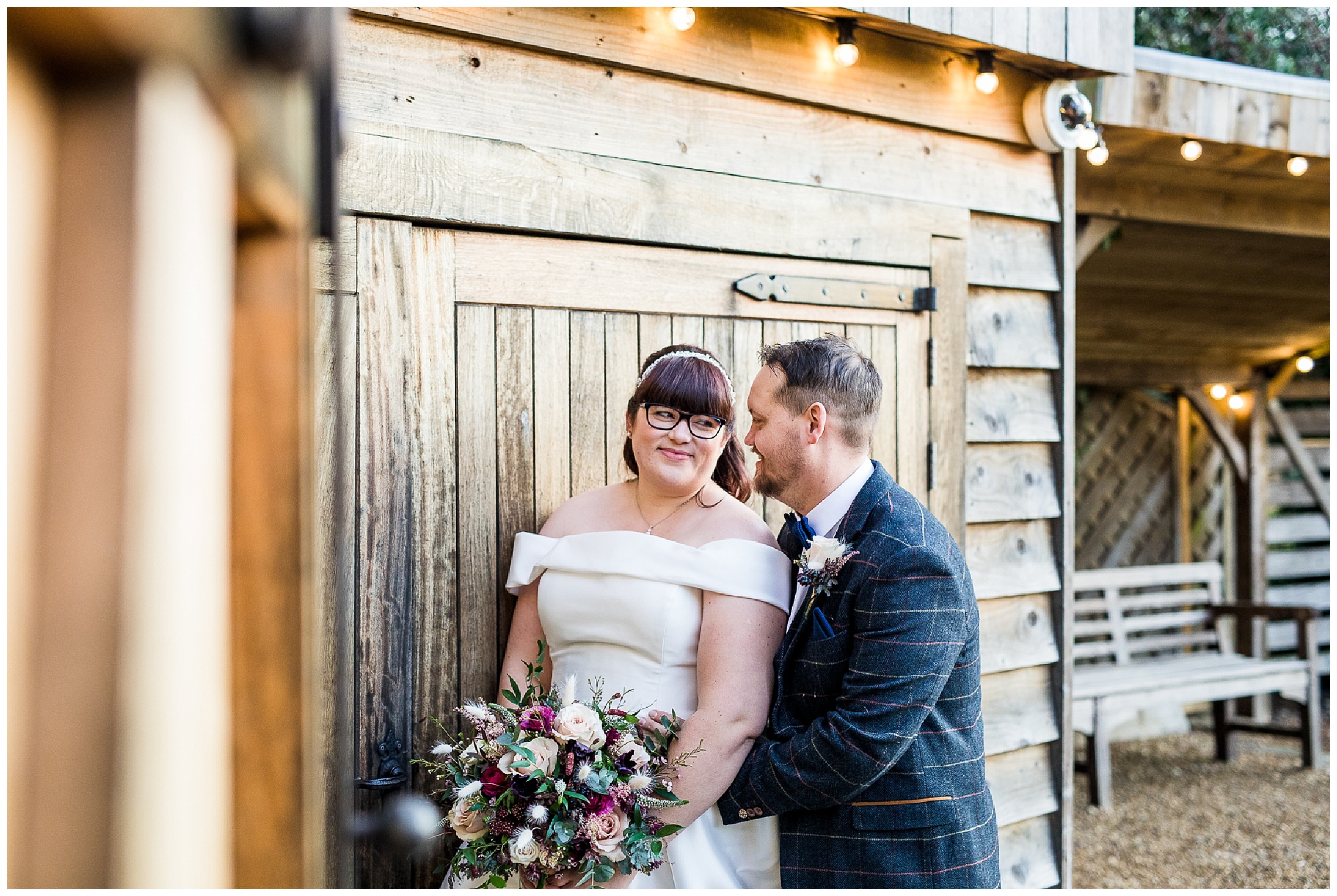 bride and groom stood together smiling