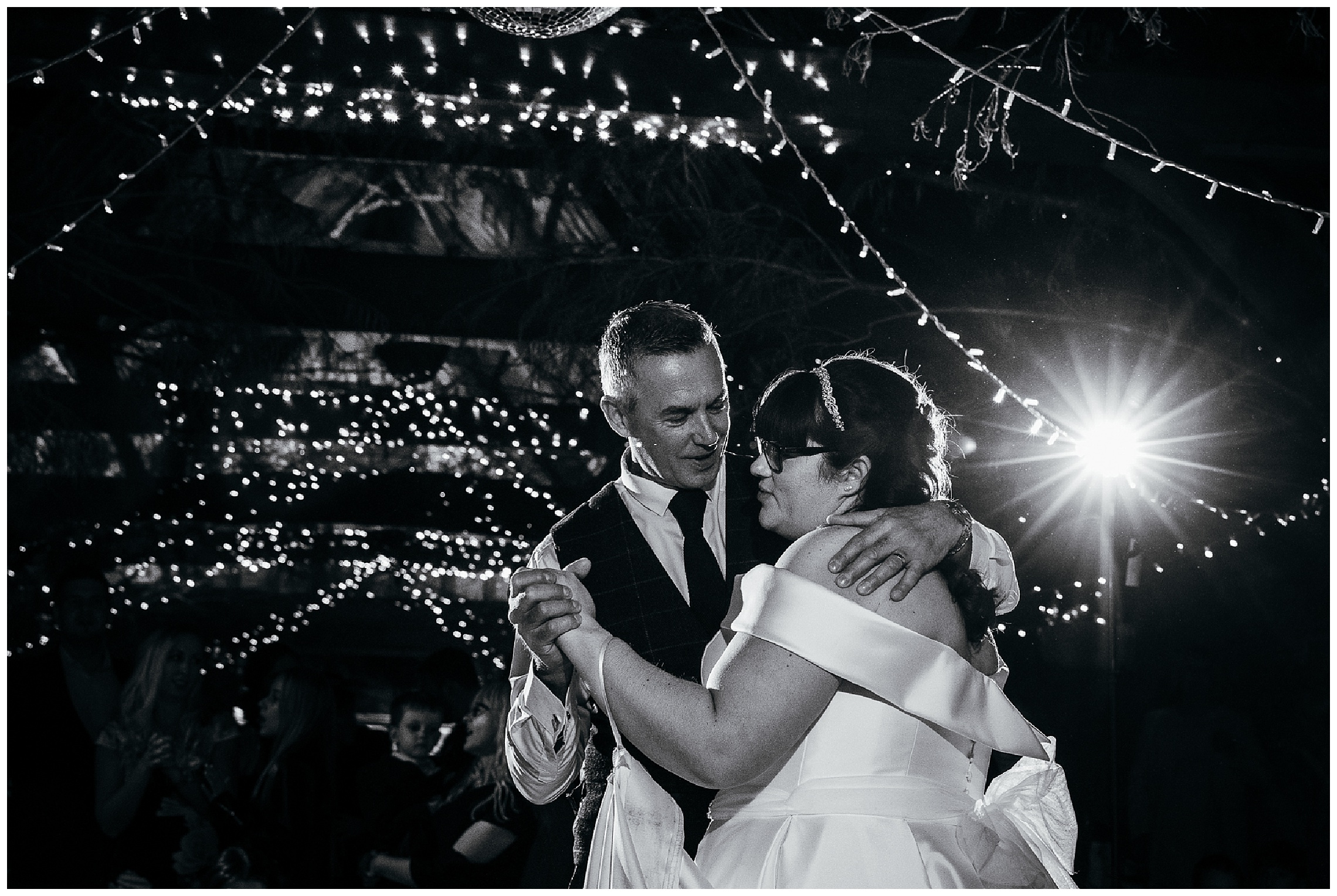 father of the bride and bride dance in barn